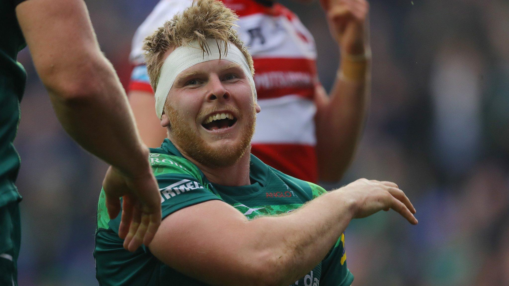 London Irish lock Josh McNally celebrates his try against Gloucester