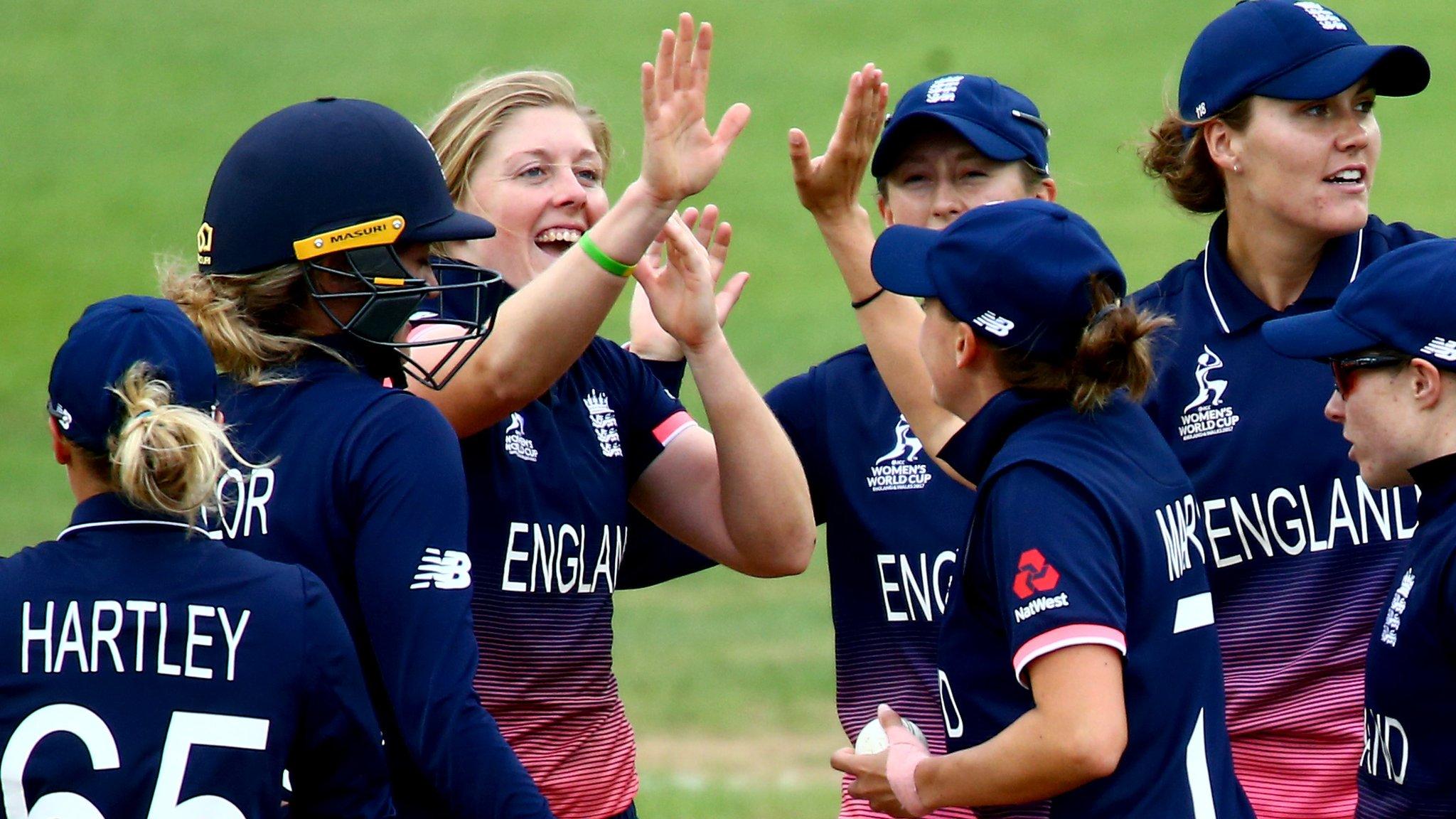 England's players celebrate a wicket against West Indies