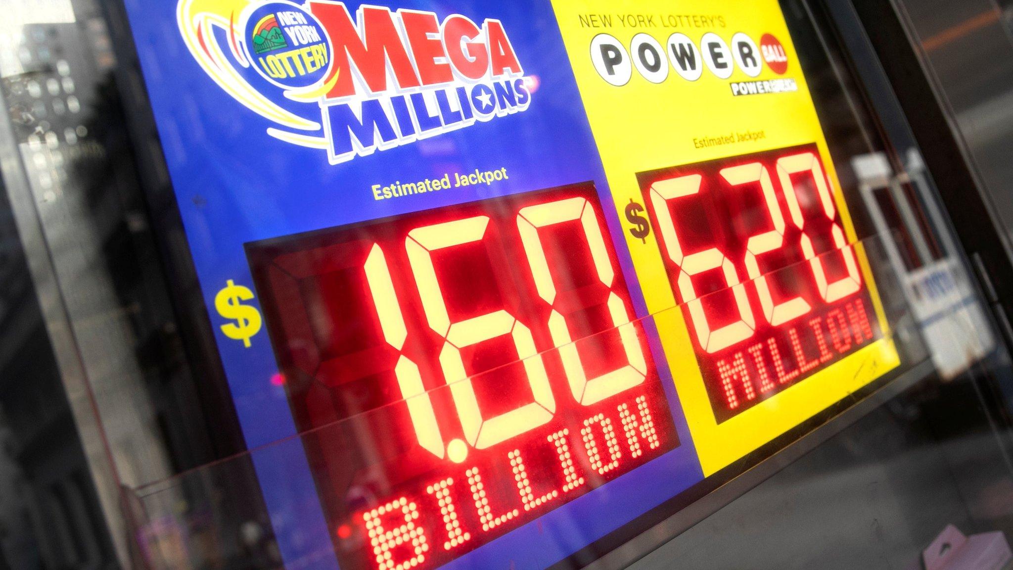 Signs for lottery jackpot in New York City on 23 October 2018