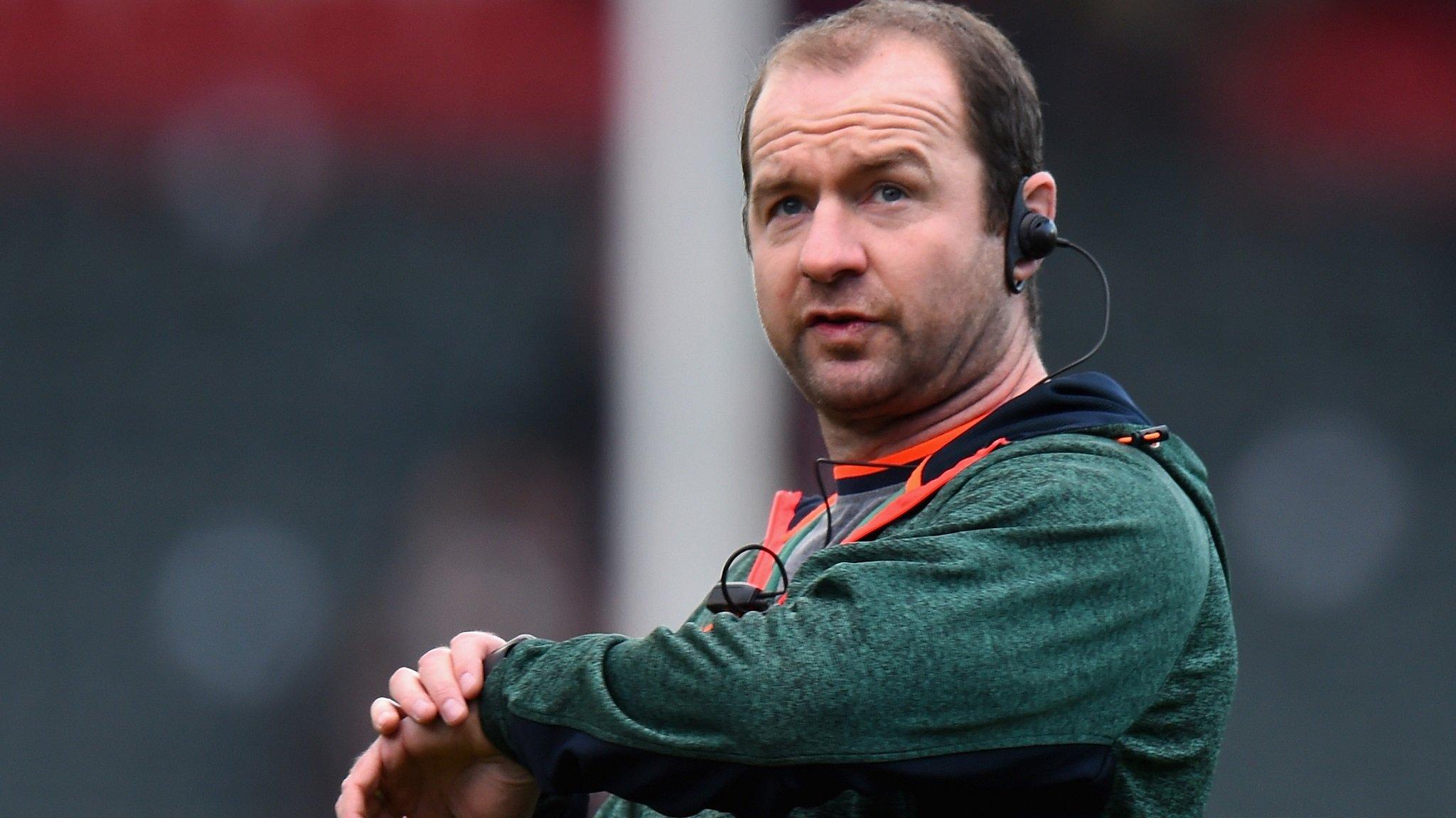 Geordan Murphy checks his watch as he takes a Leicester Tigers training session