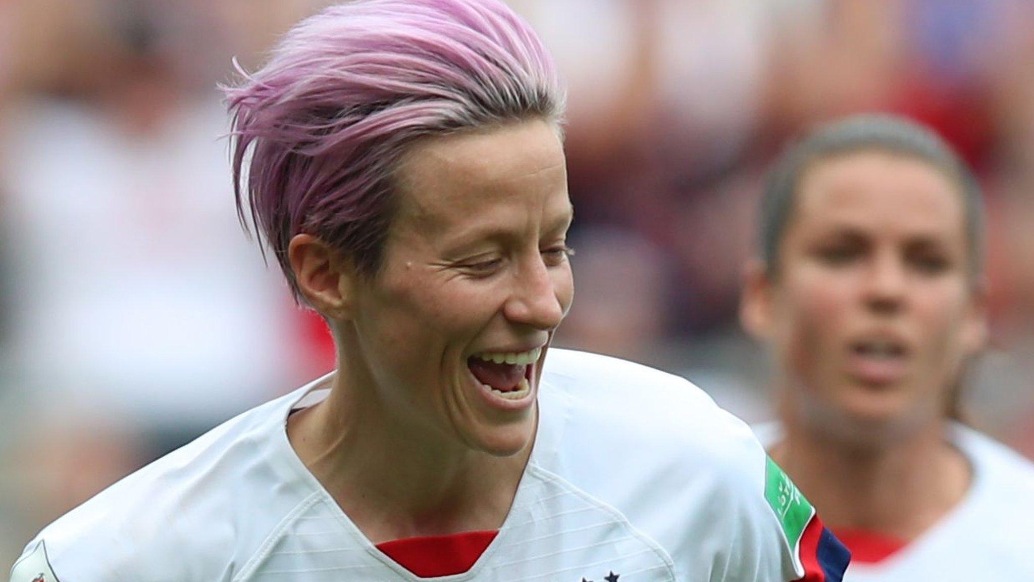 Megan Rapinoe (left) celebrates scoring for USA