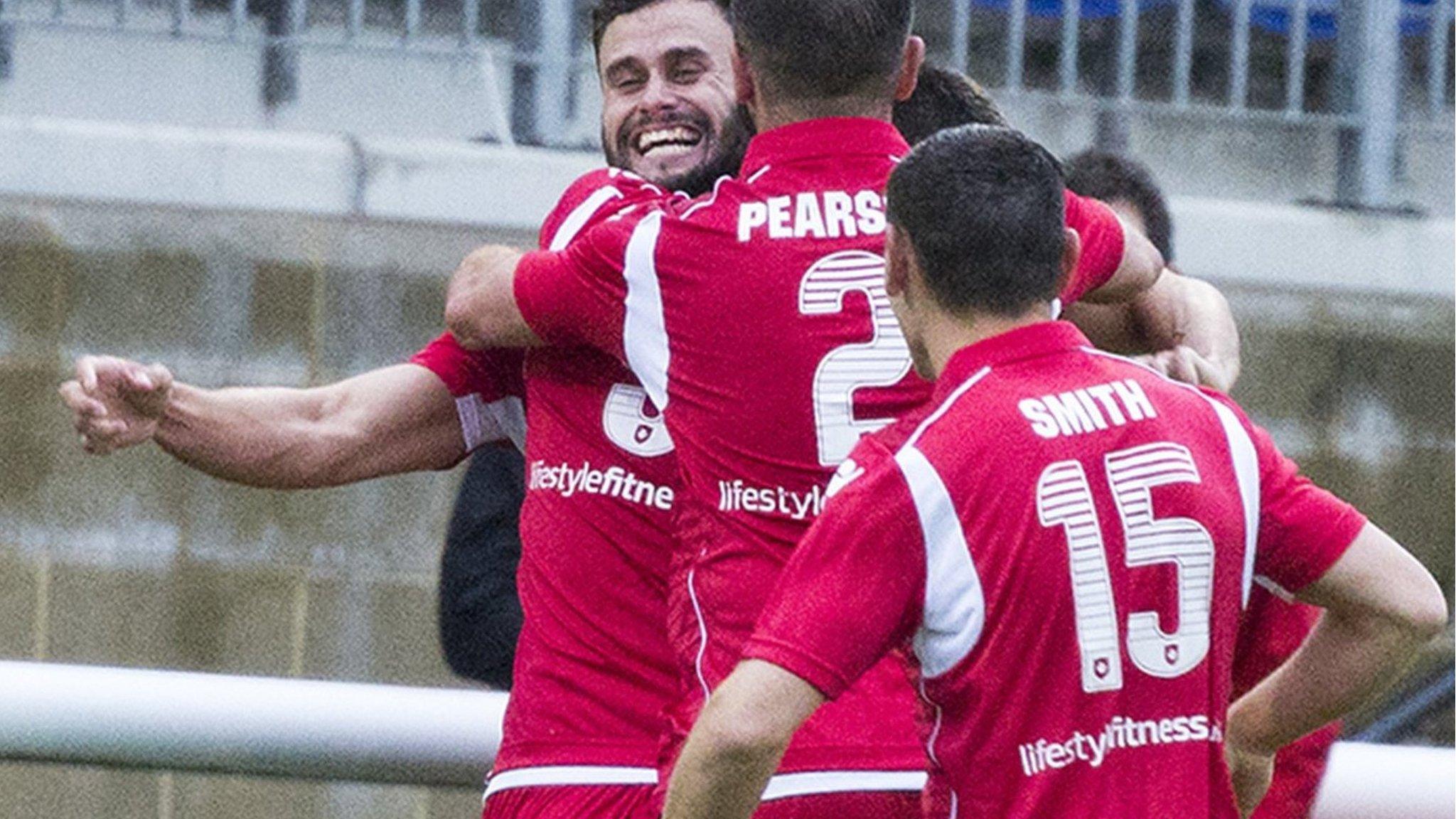 Nathan Woolfe celebrates with team mates