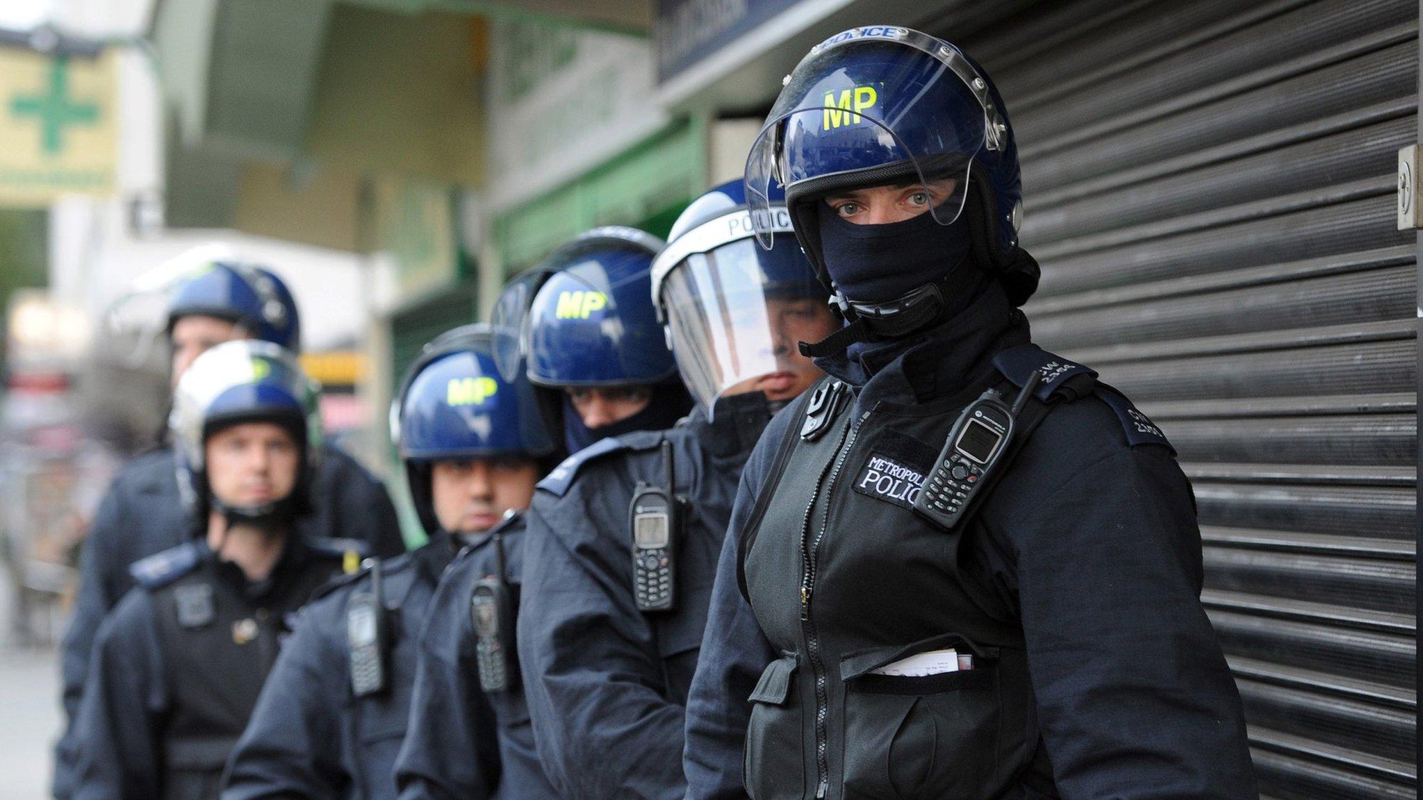 Police officers in protective gear