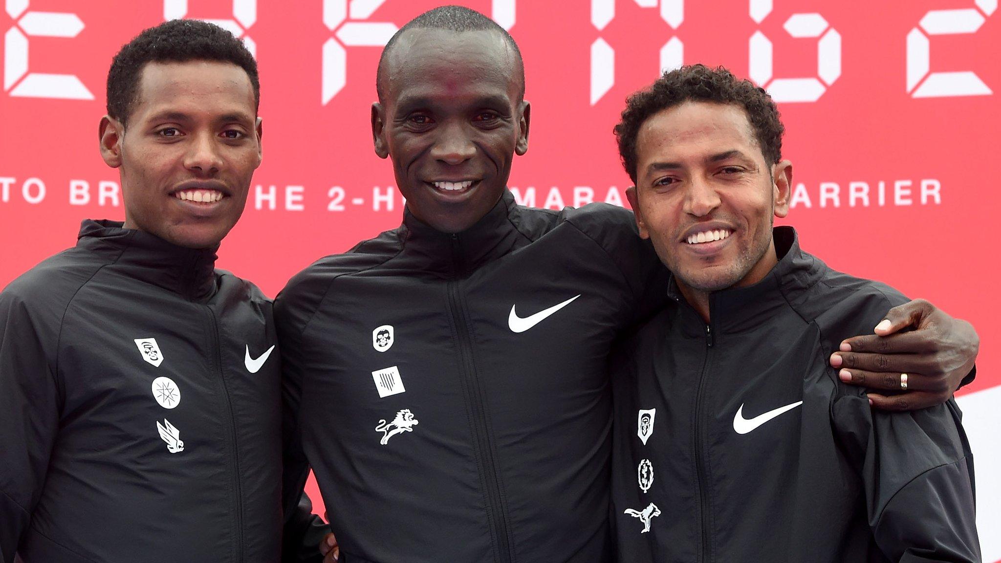 Tadese (right) and Desisa (left) faded, while Kipchoge was on target pace with five miles remaining