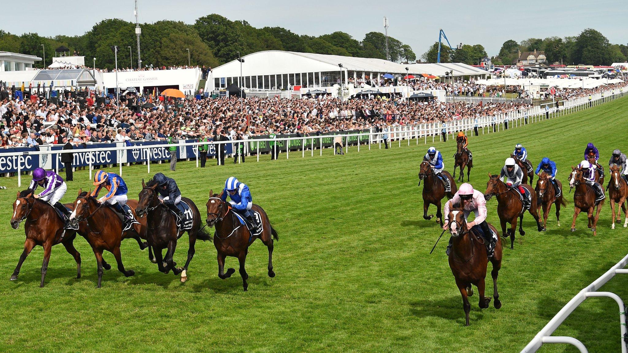 Surrey, England - 1 June: Jockey Seamie Heffernan rides Anthony Van Dyck (R) to victory in the Derby Stakes on the second day of the Epsom Derby Festival (Photo by Glyn Kirk/AFP/Getty Images)