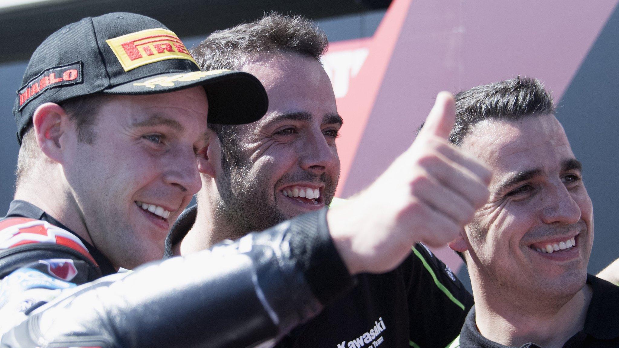 Jonathan Rea celebrates his win with Kawasaki mechanics