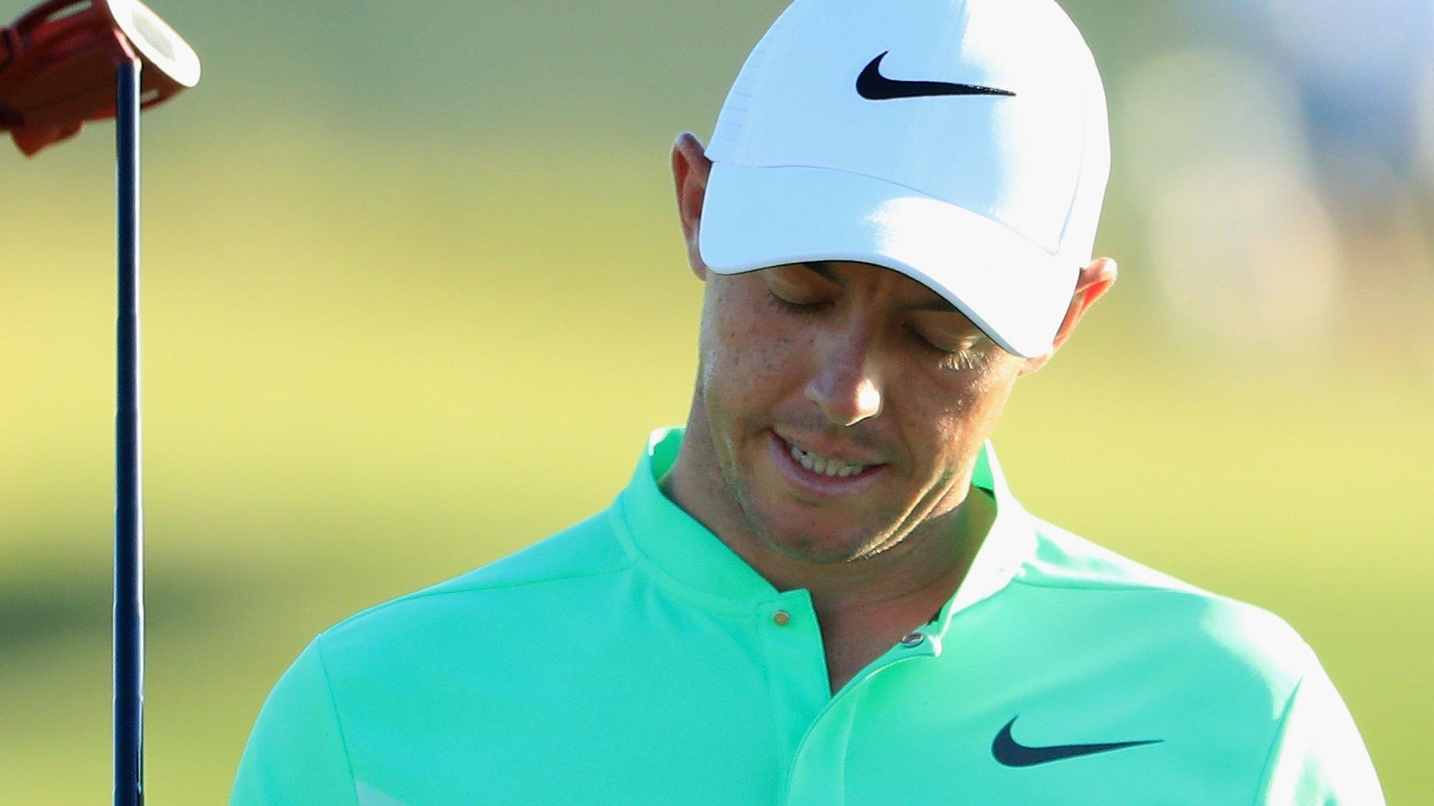 Frustration for Rory McIlroy after he misses a putt in the first round