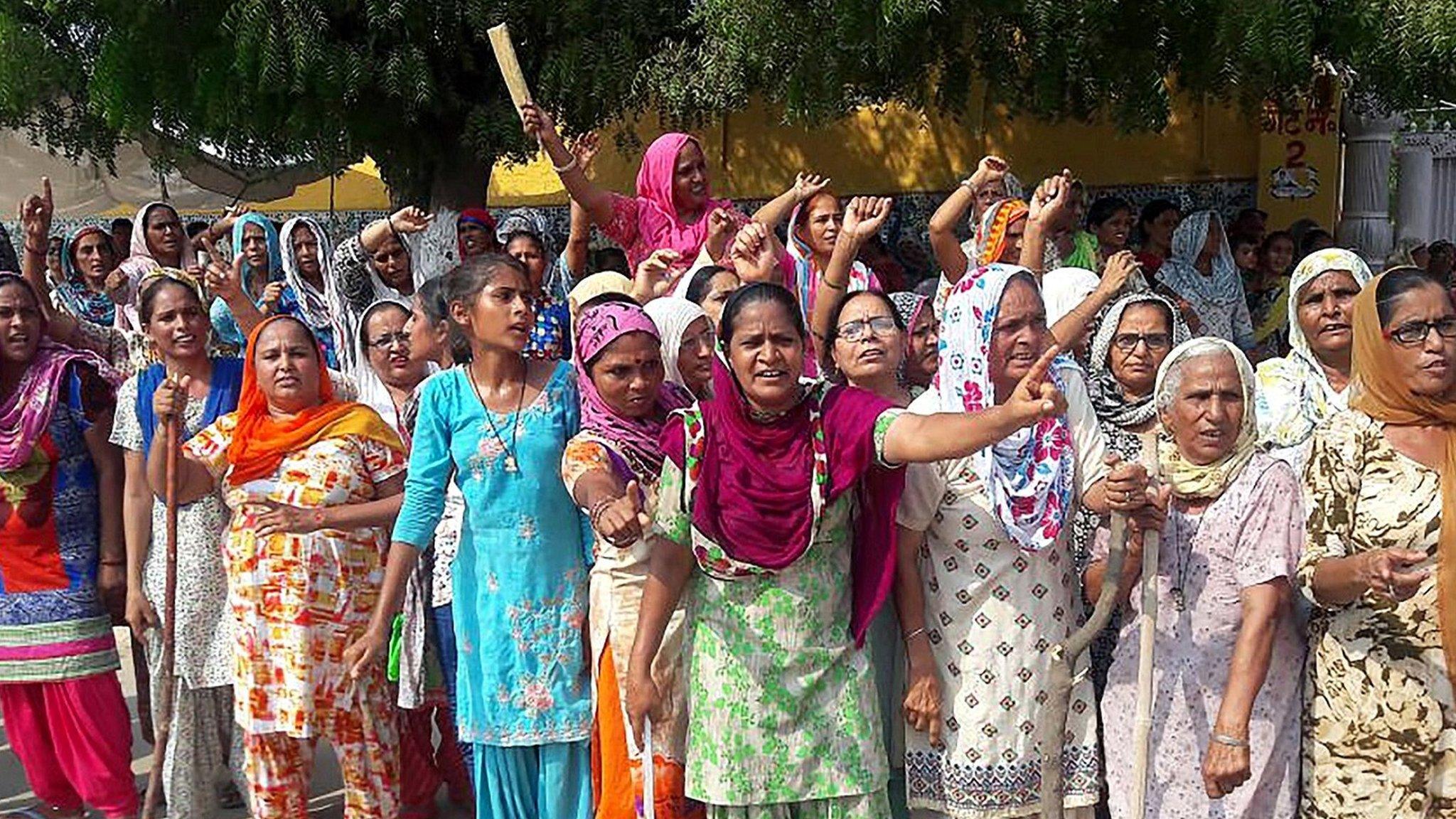 Followers of the controversial Gurmeet Ram Rahim Singh flock to see the Guru, due in court