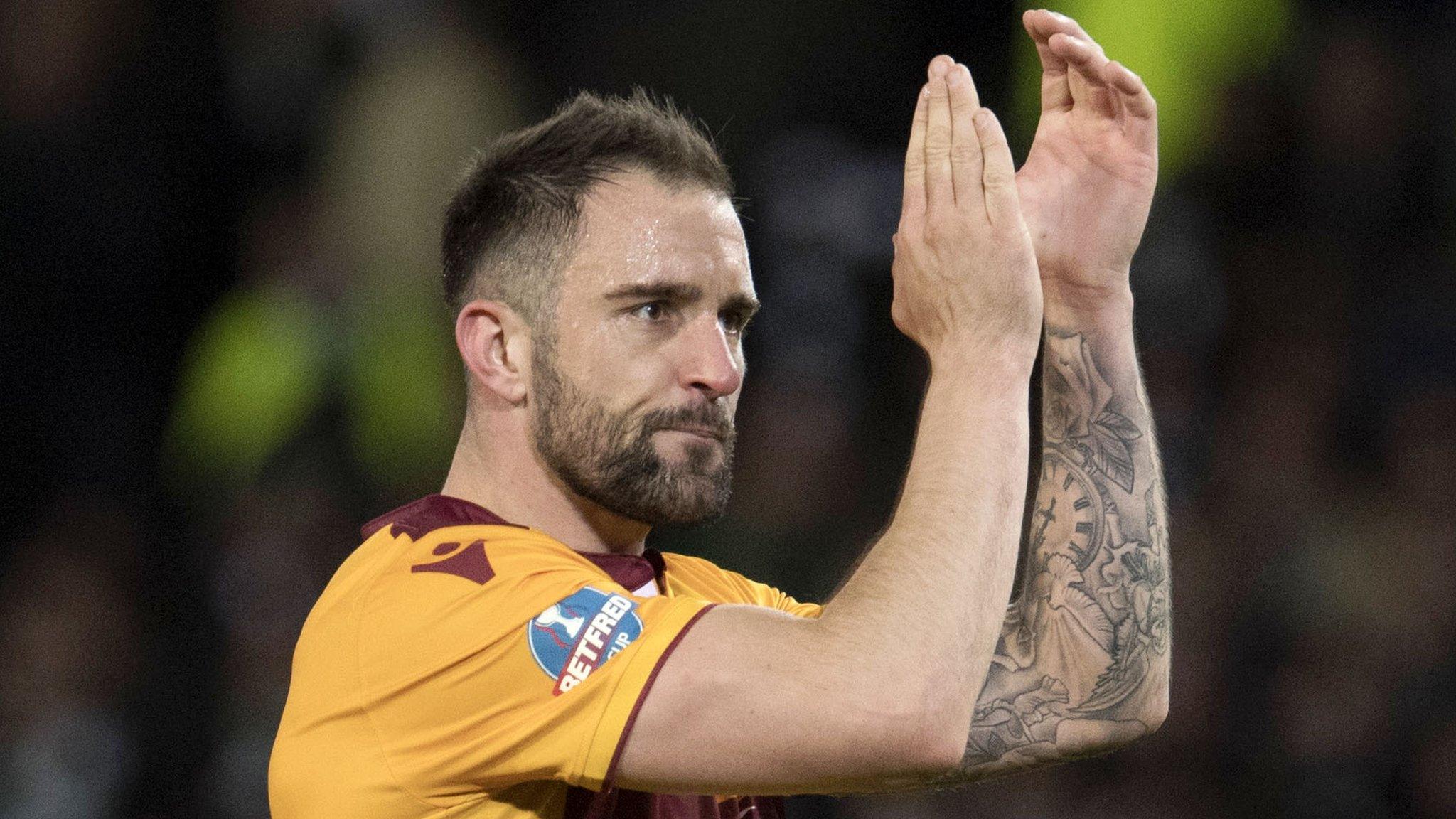 Peter Hartley salutes the Motherwell supporters