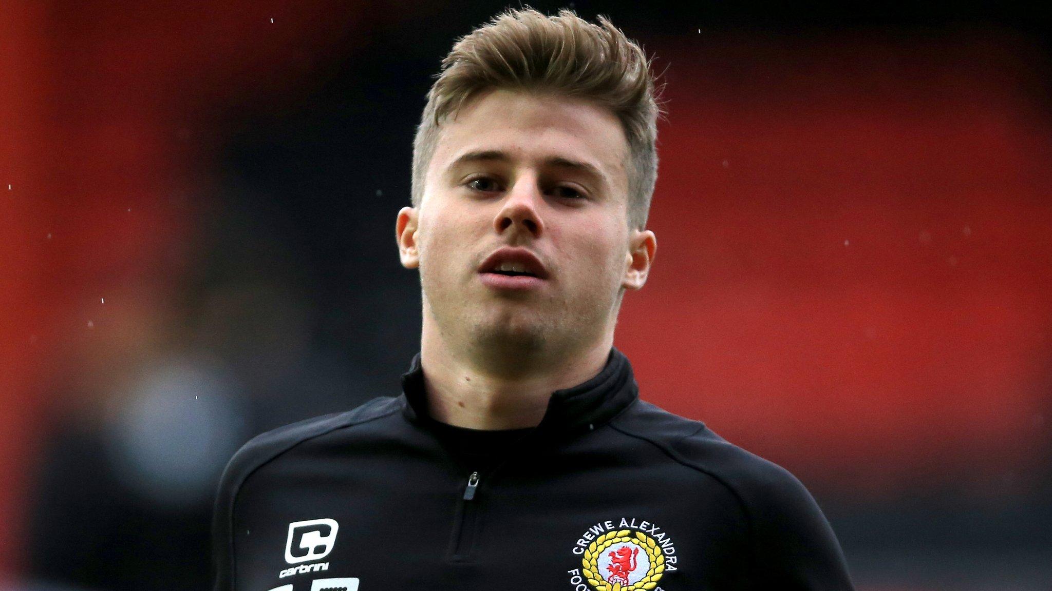 James Jones warms up for Crewe ahead of their League Two game against Crawley in December 2016