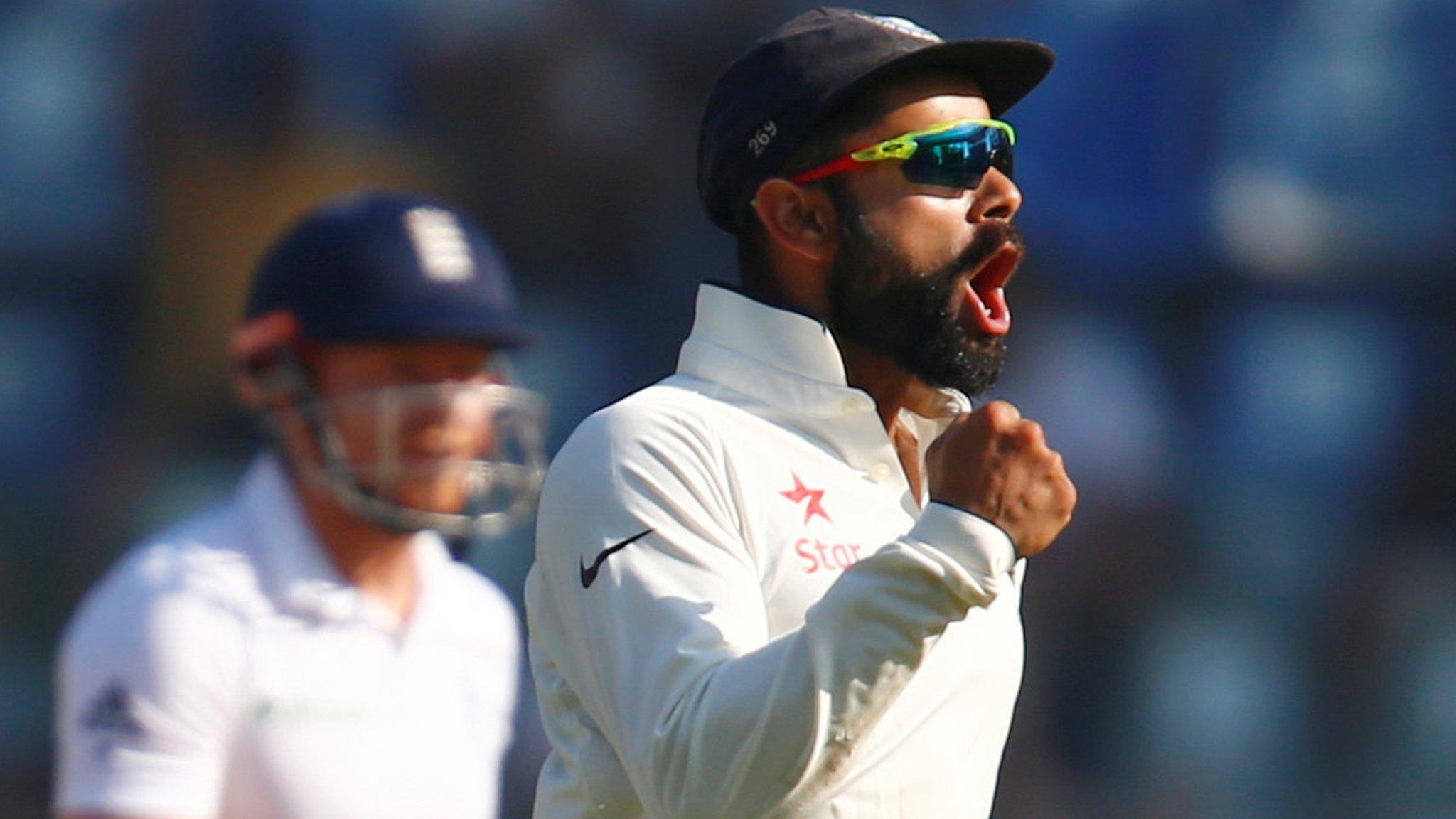 Virat Kohli celebrates