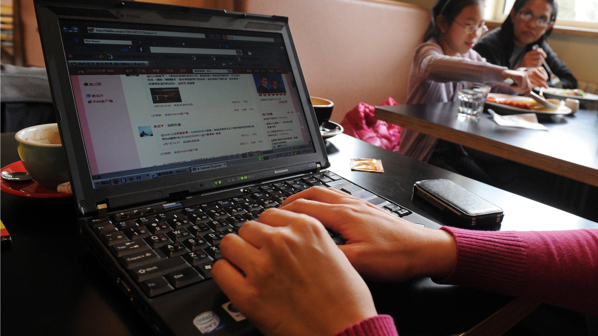 A woman surfs the internet at a cafe in Beijing on April 2, 2012.