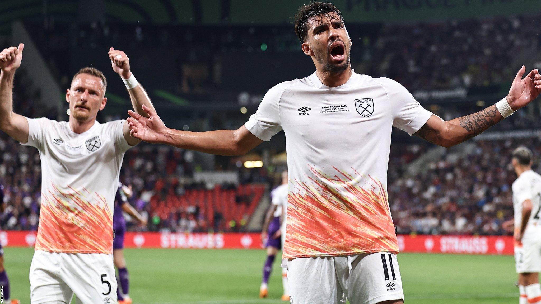 West Ham's Lucas Paqueta tries to calm fans after plastic glasses were thrown at Cristiano Biraghi of Fiorentina during the first half