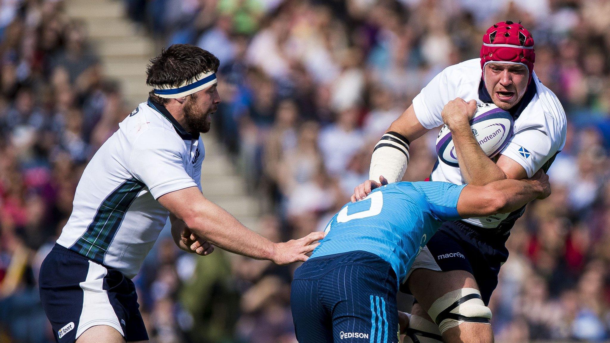 Grant Gilchrist is tackled by Tommaso Allan