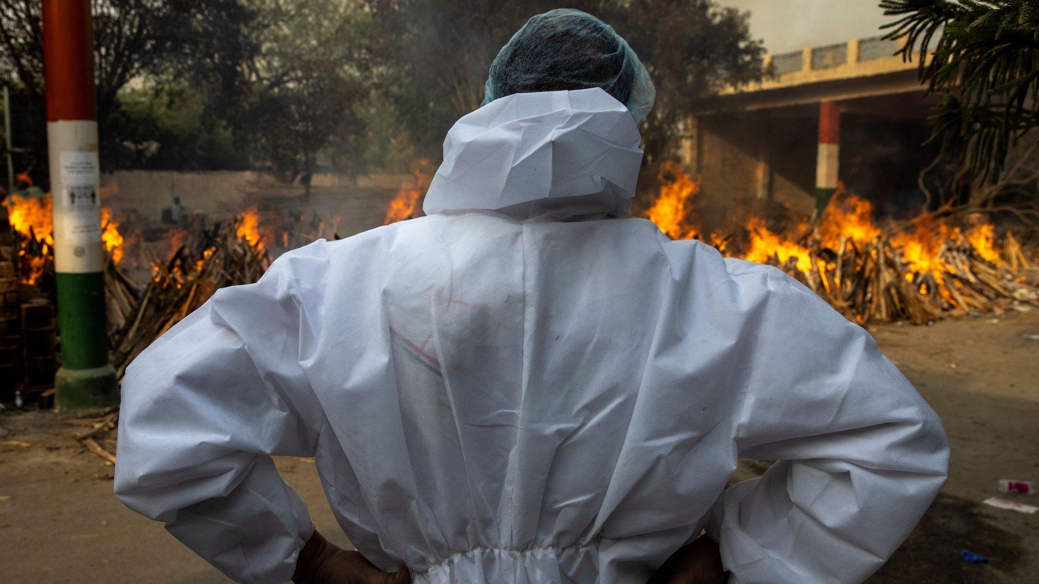 Abhishek Bhardwaj stands after cremating his mother, who died due to the coronavirus disease (COVID-19), at a crematorium ground in New Delhi, India, April 28, 2021.