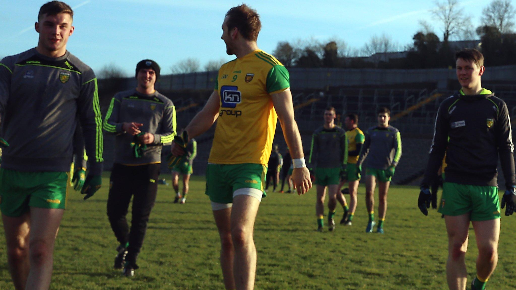 Donegal players walk off the Clones pitch after their match against Monaghan is postponed