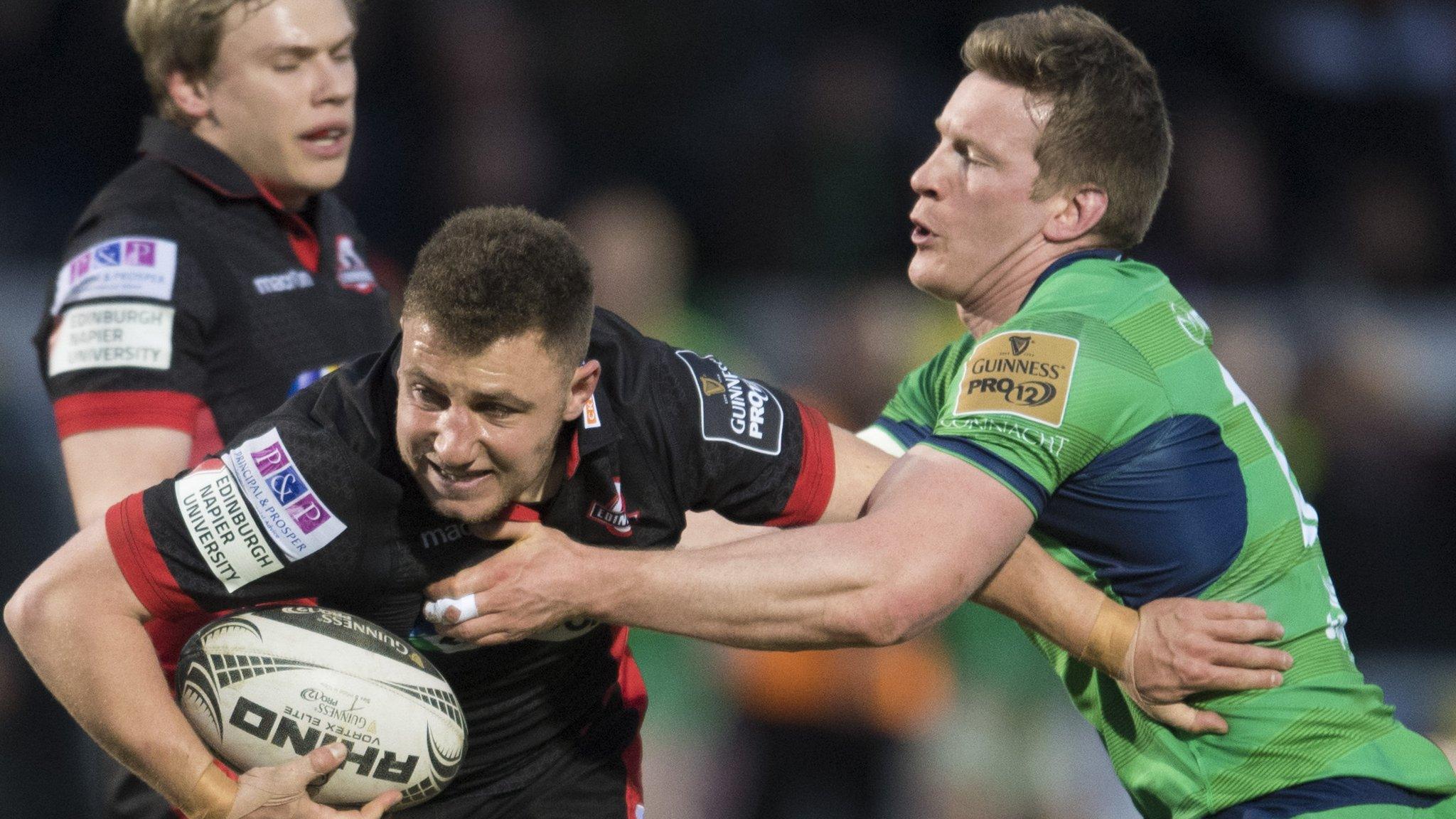 Edinburgh fly-half Duncan Weir tries to escape the tackle of Connacht's Eoin Griffin