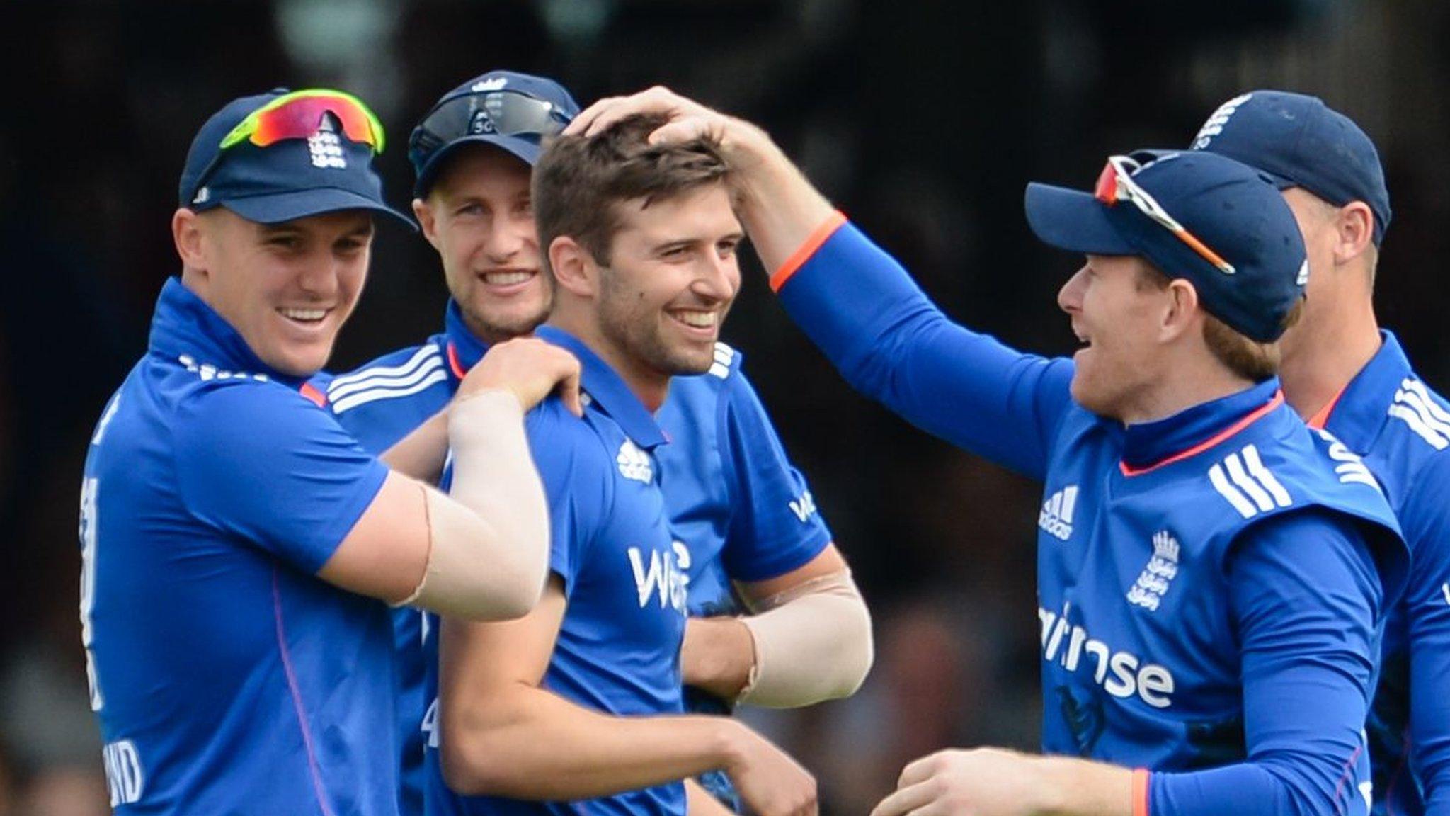 Mark Wood (centre) is congratulated by England team-mates