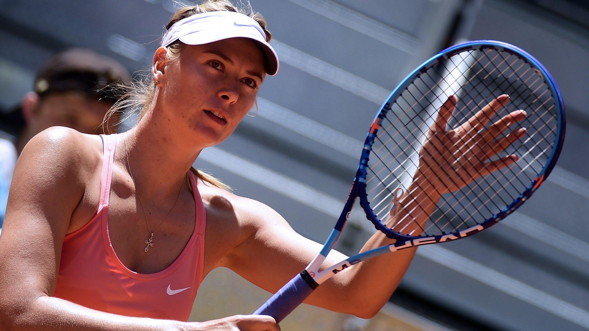 Maria Sharapova holding a Head racquet