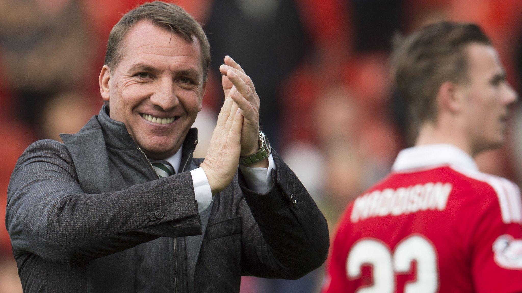 Brendan Rodgers applauds Celtic fans after their win at Aberdeen