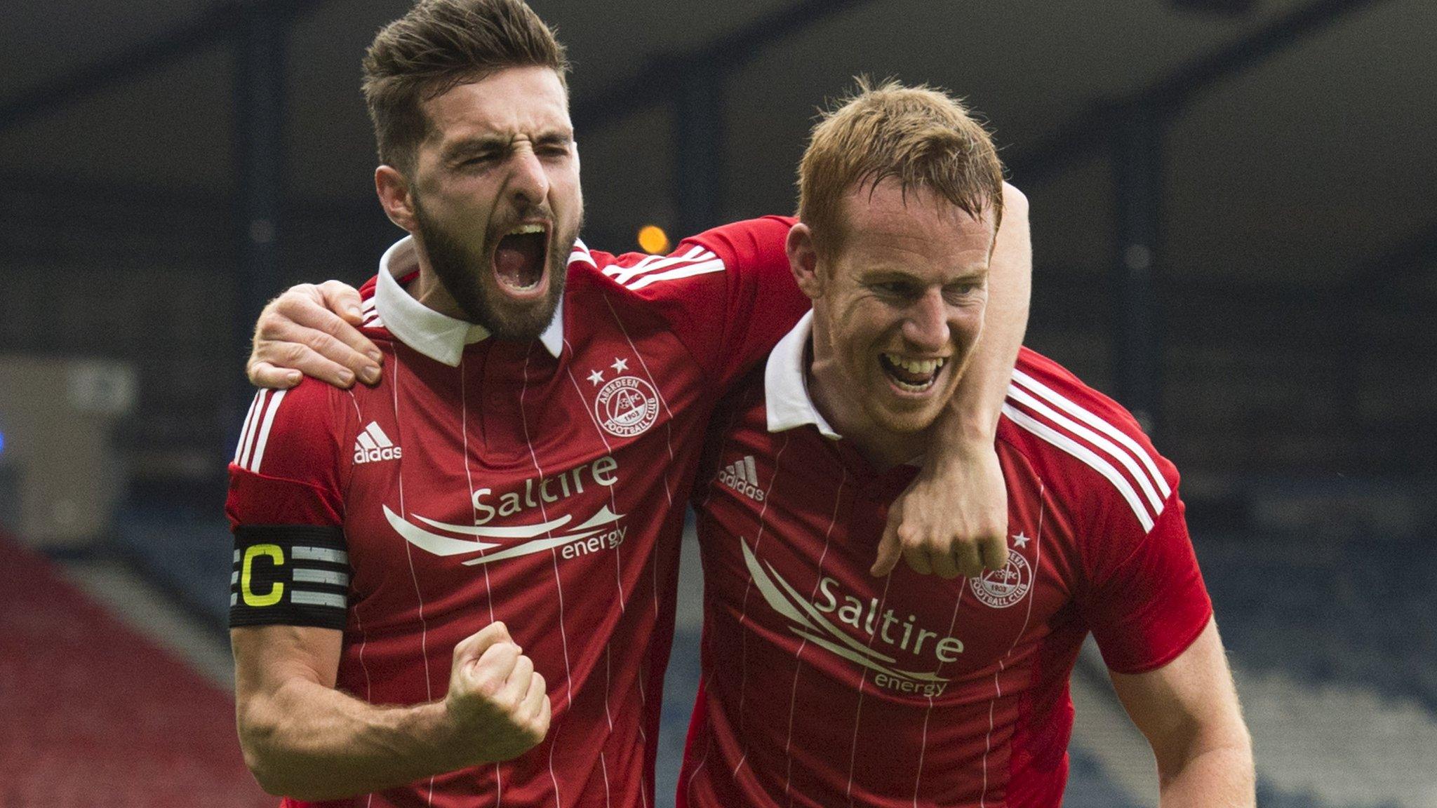 Goalscorer Adam Rooney celebrates with Aberdeen captain Graeme Shinnie