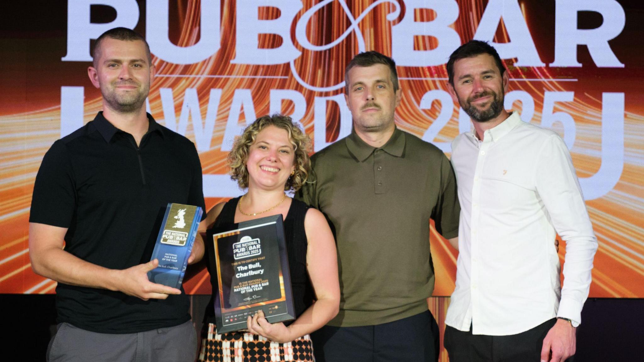The pub's team, including Murray Ward [second from the right], collecting the award on Tuesday.