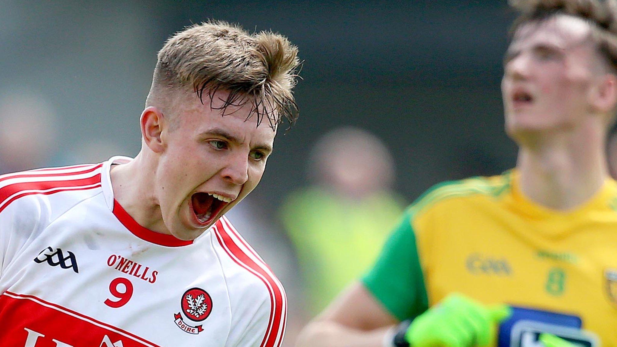 Derry's Oisin McWilliams celebrates scoring a point against Donegal