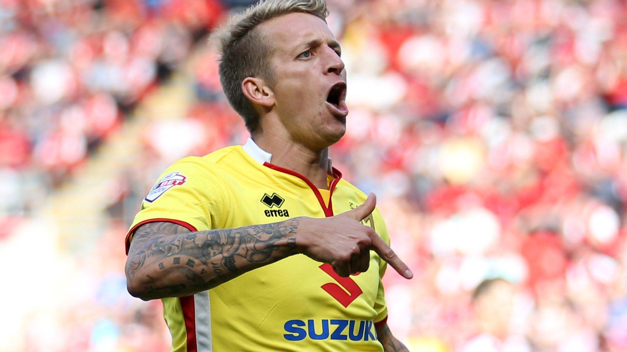 Carl Baker celebrates MK Dons' fourth goal