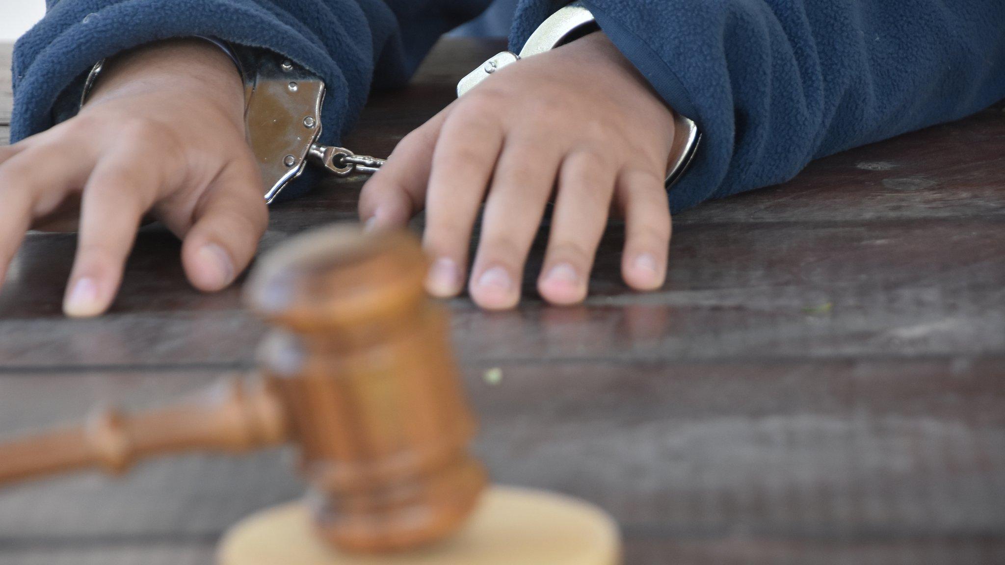 A child in handcuffs (file)