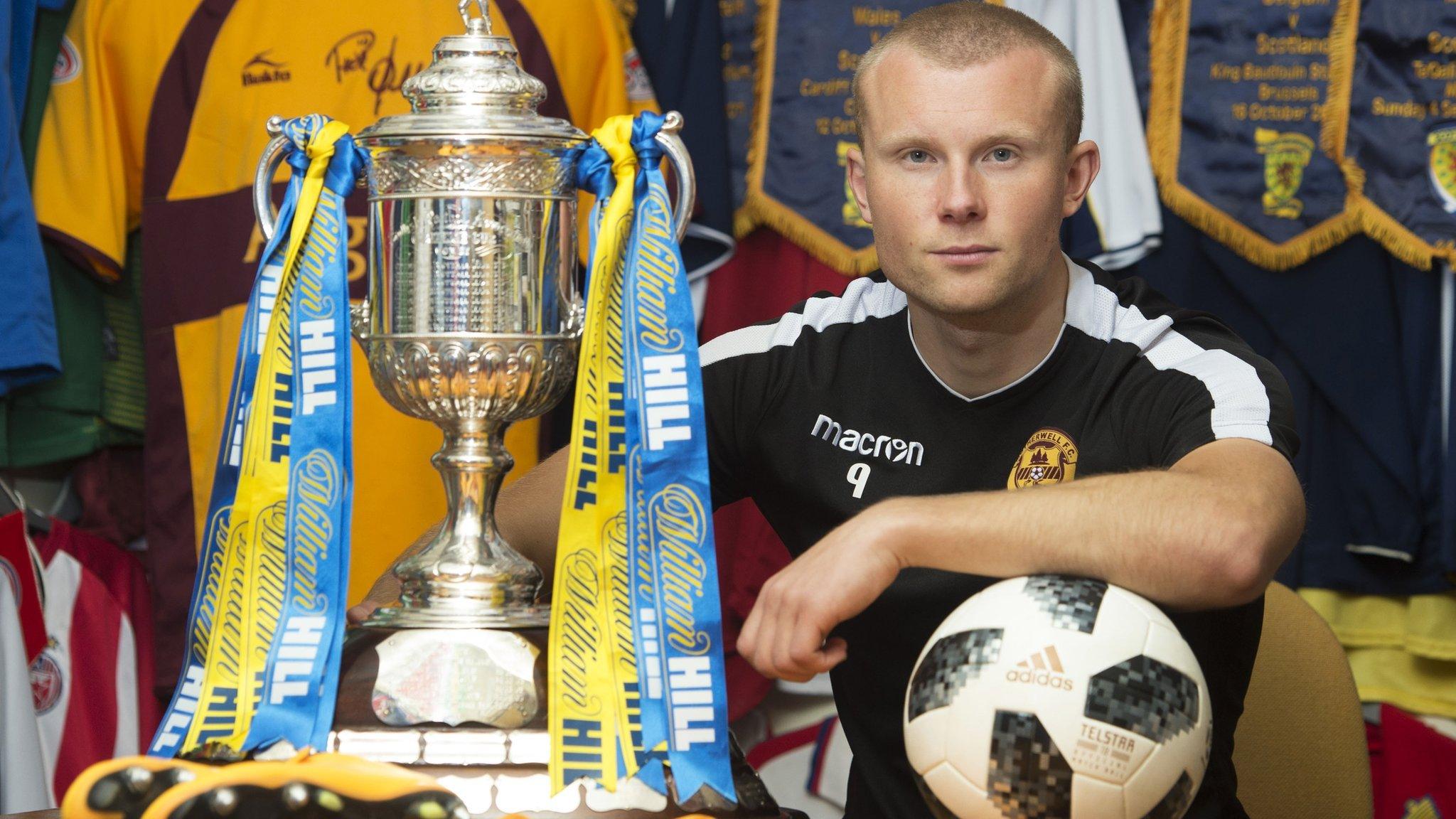 Motherwell striker Curtis Main poses with the Scottish Cup