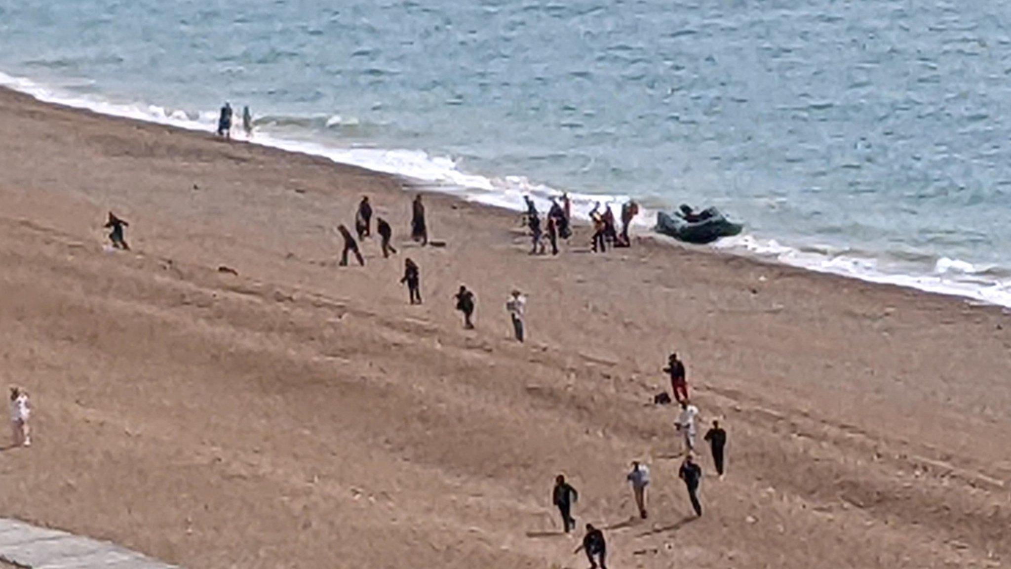 People arriving on the beach at Folkestone by boat