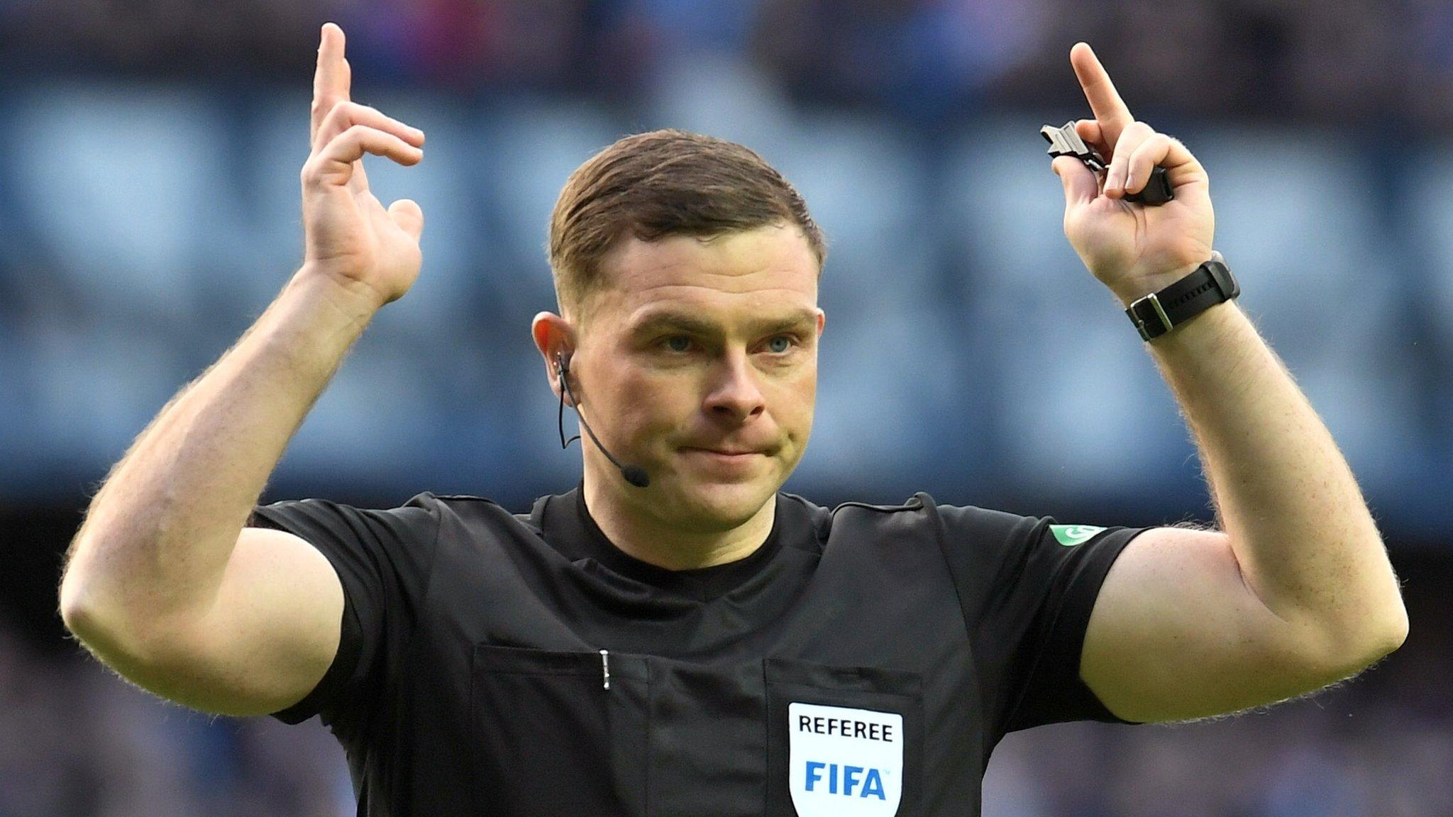 Referee John Beaton makes a signal during the recent Old Firm game