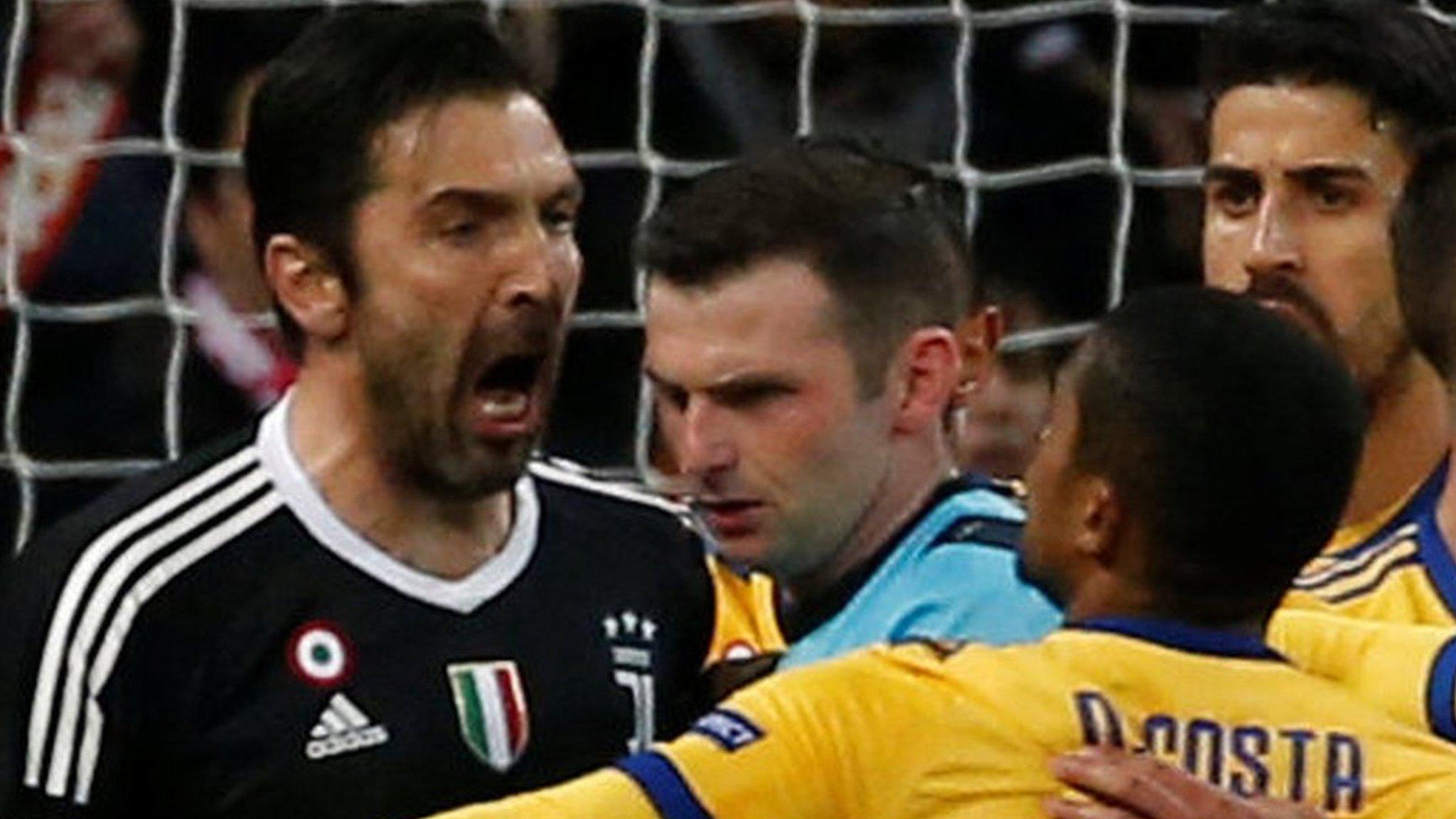 Gianluigi Buffon and Michael Oliver