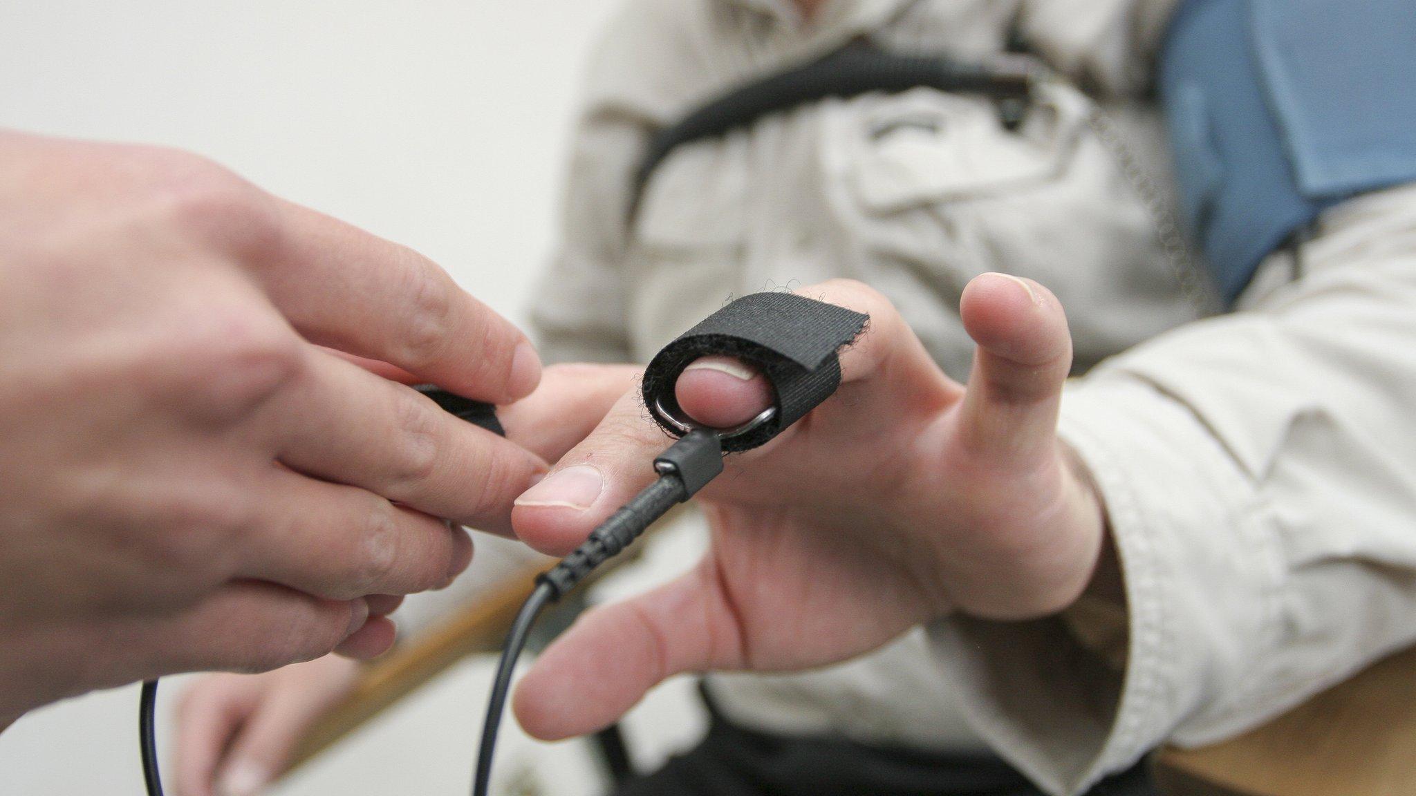 Man recieiving polygraph