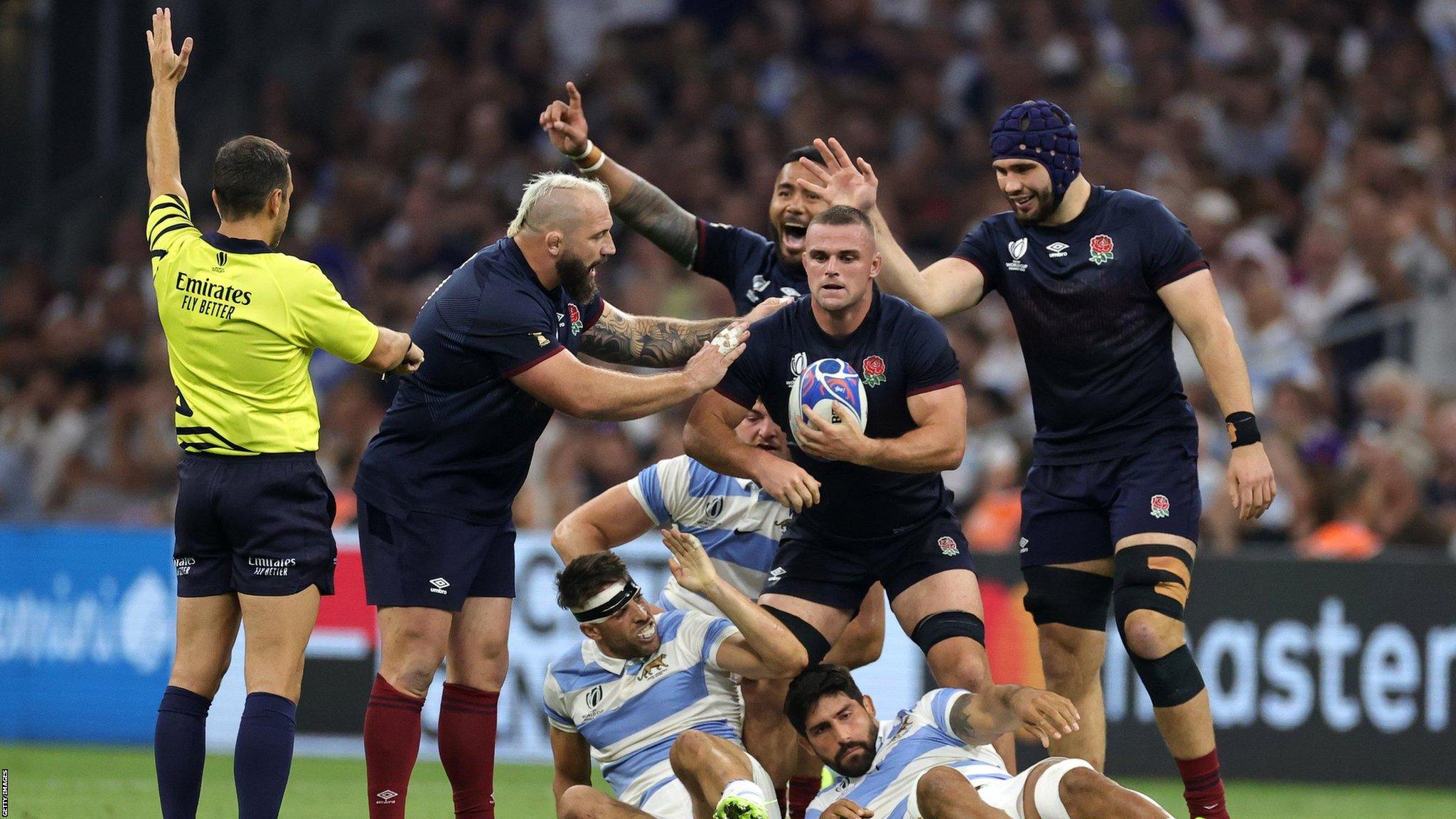 England celebrate after being awarded a penalty against Argentina