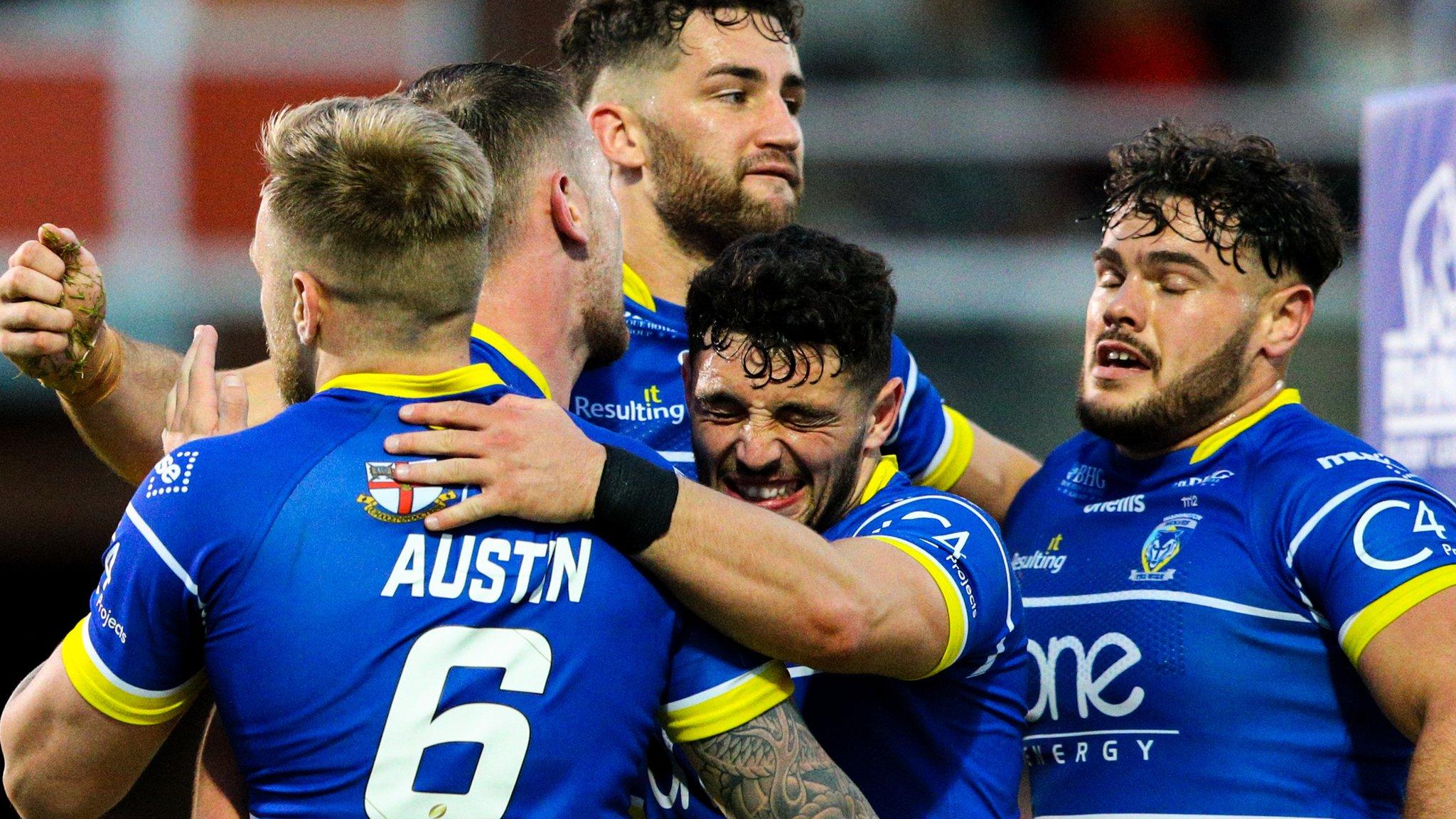 Warrington players celebrate Ben Currie's try against Hull KR