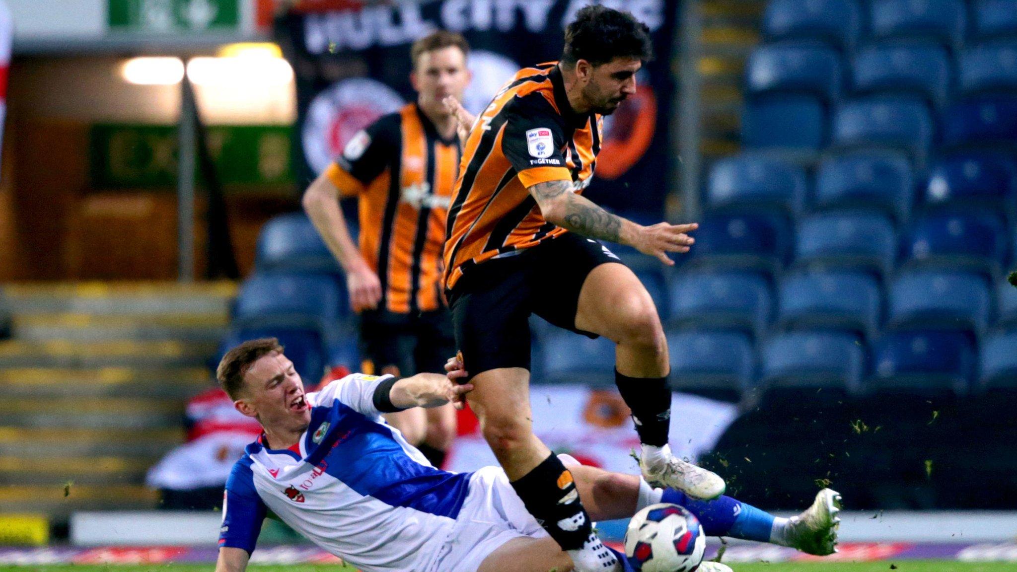 Hull's Ozan Tufan is tackled by Blackburn's Hayden Carter at Ewood Park