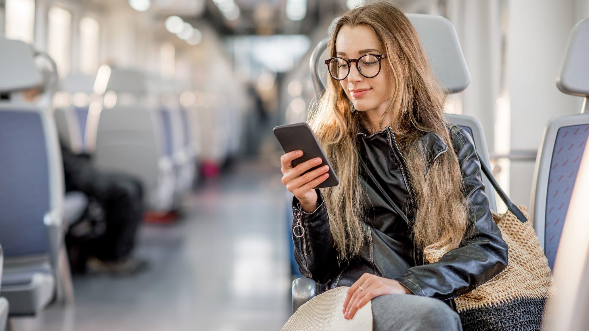 Woman sitting on train