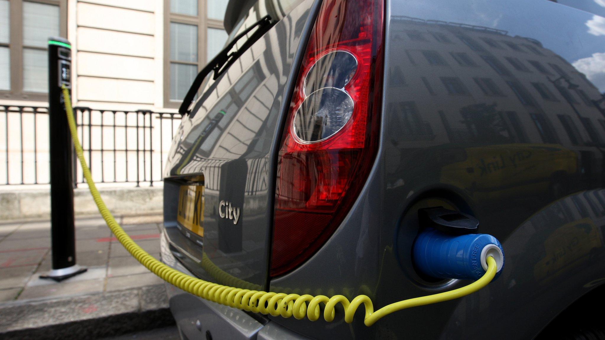 Electric car plugged in and charging