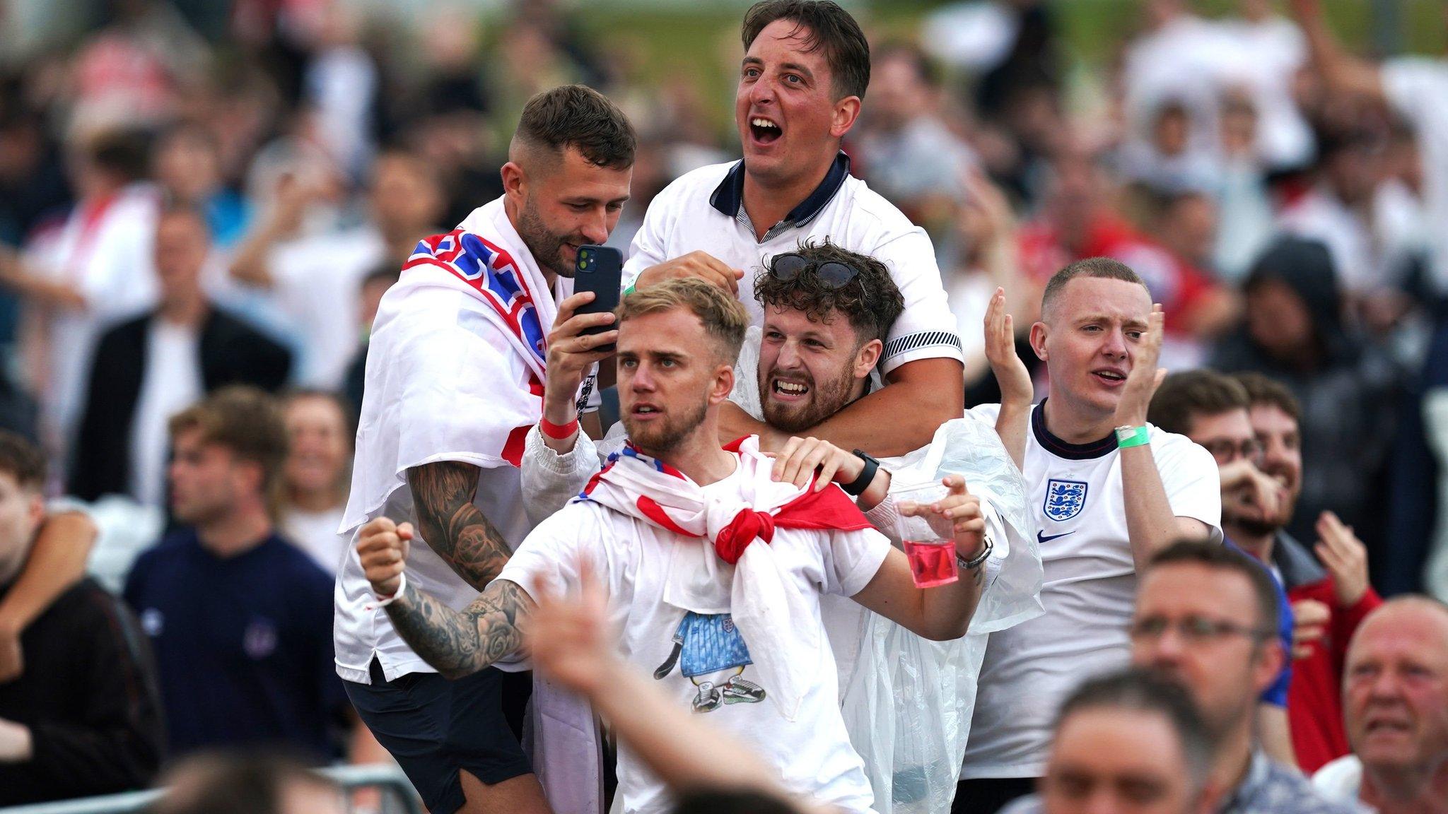 Fans in Manchester cheer Harry Maguire's goal for England