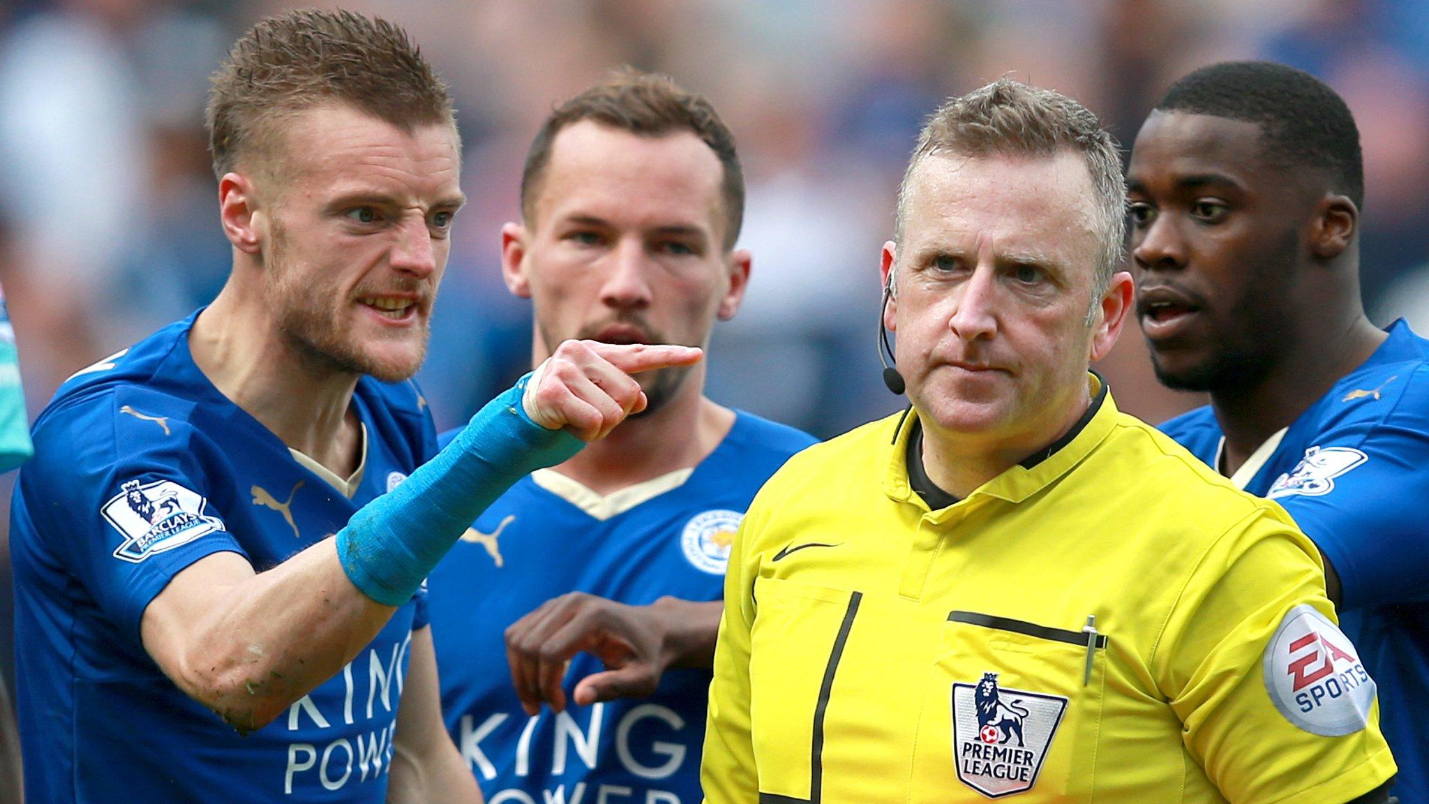 Leicester striker Jamie Vardy gestures at referee Jon Moss after his red card