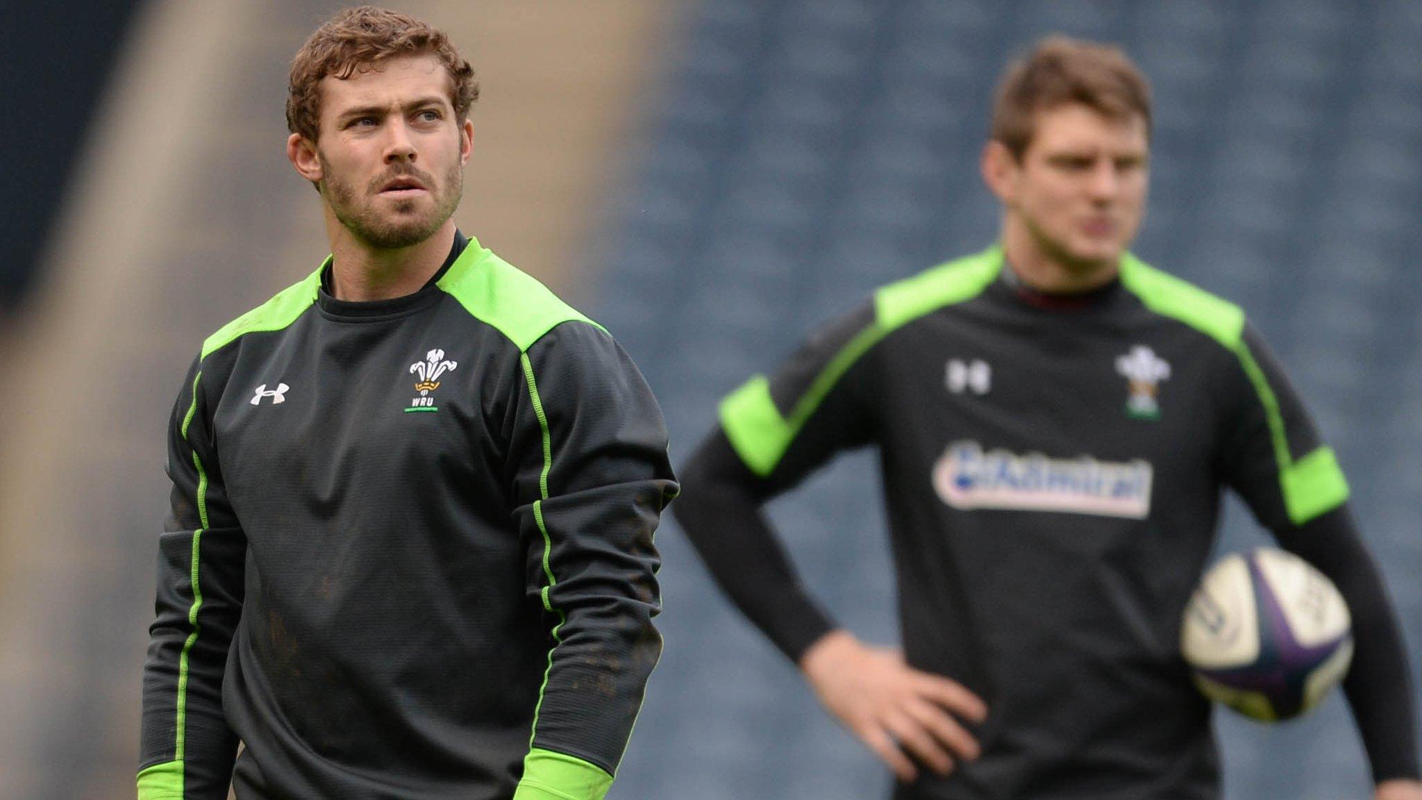 Leigh Halfpenny prepares to kick with Dan Biggar looking on