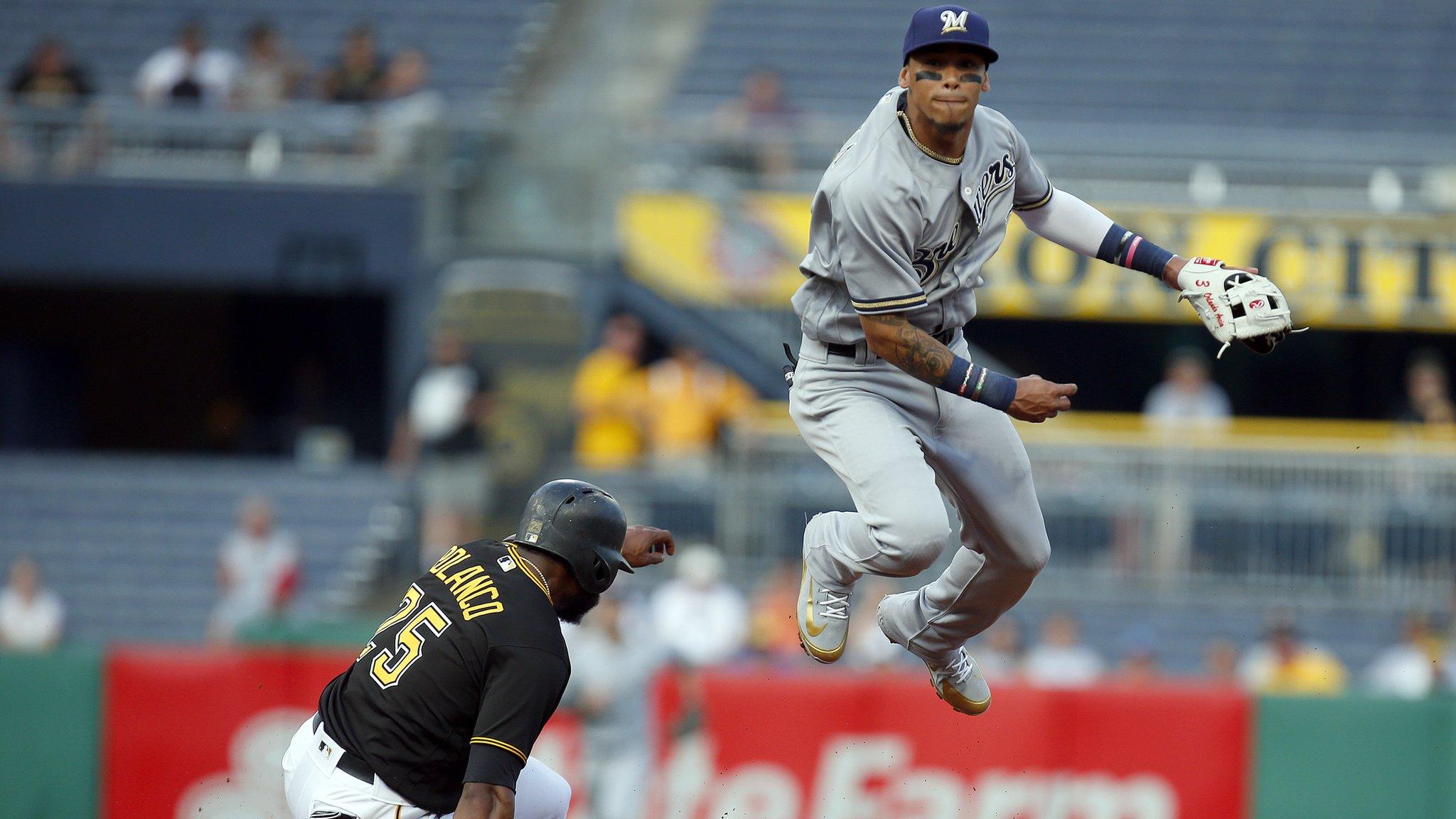 PITTSBURGH, PA - JUNE 18: Orlando Arcia #3 of the Milwaukee Brewers turns a double play in the second inning against Gregory Polanco #25 of the Pittsburgh Pirates at PNC Park on June 18, 2018 in Pittsburgh, Pennsylvania. (Photo by Justin K. Aller/Getty Images)