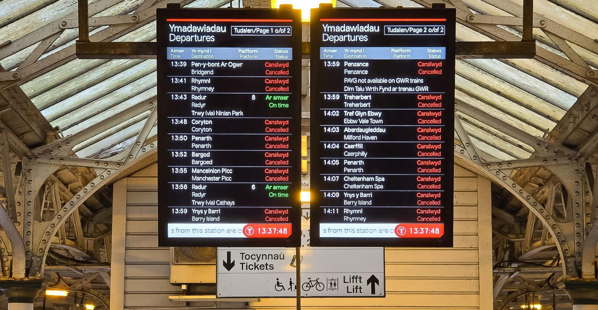 The departures and arrivals board in Cardiff Central Station. I showed red next to every service, all in red except for one, in green