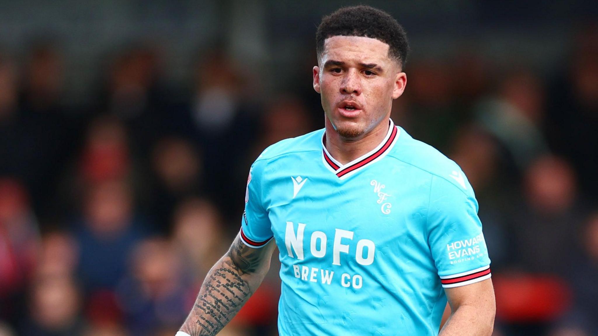 Walsall defender Rico Browne in the light blue away kit.