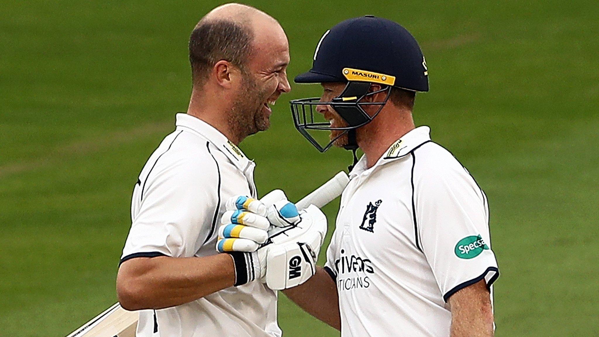 Jonathan Trott and Ian Bell celebrate Trott's century