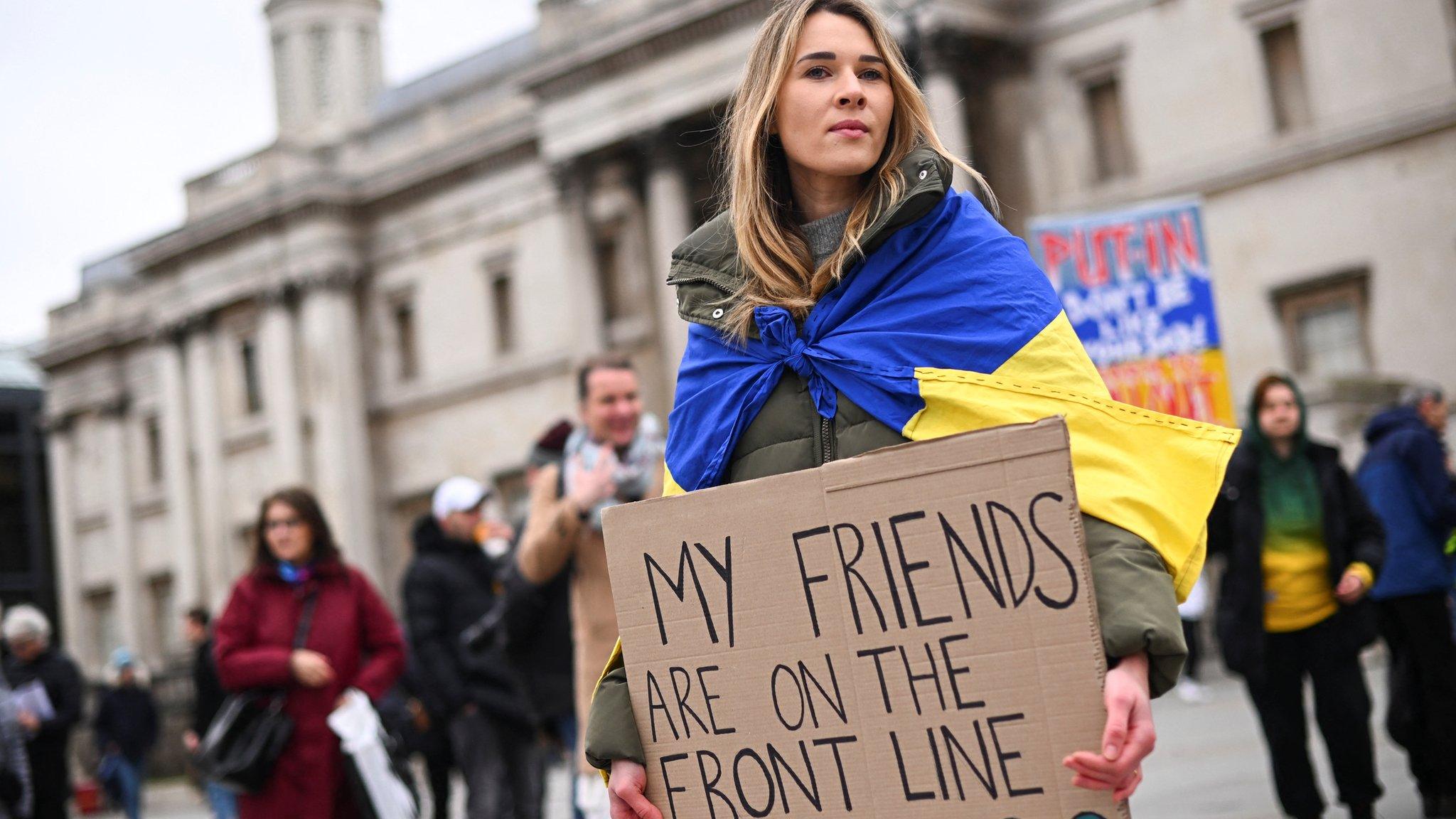 Woman holding banner