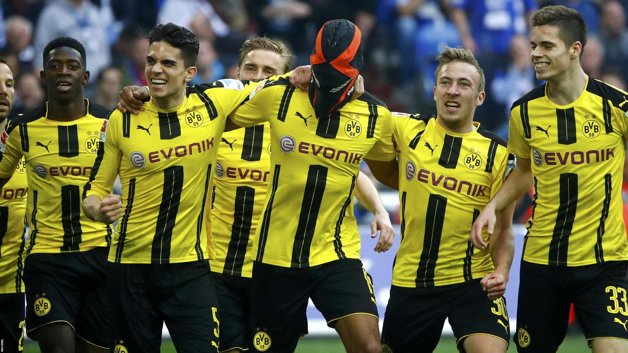 Borussia Dortmund's players celebrate scoring against Schalke