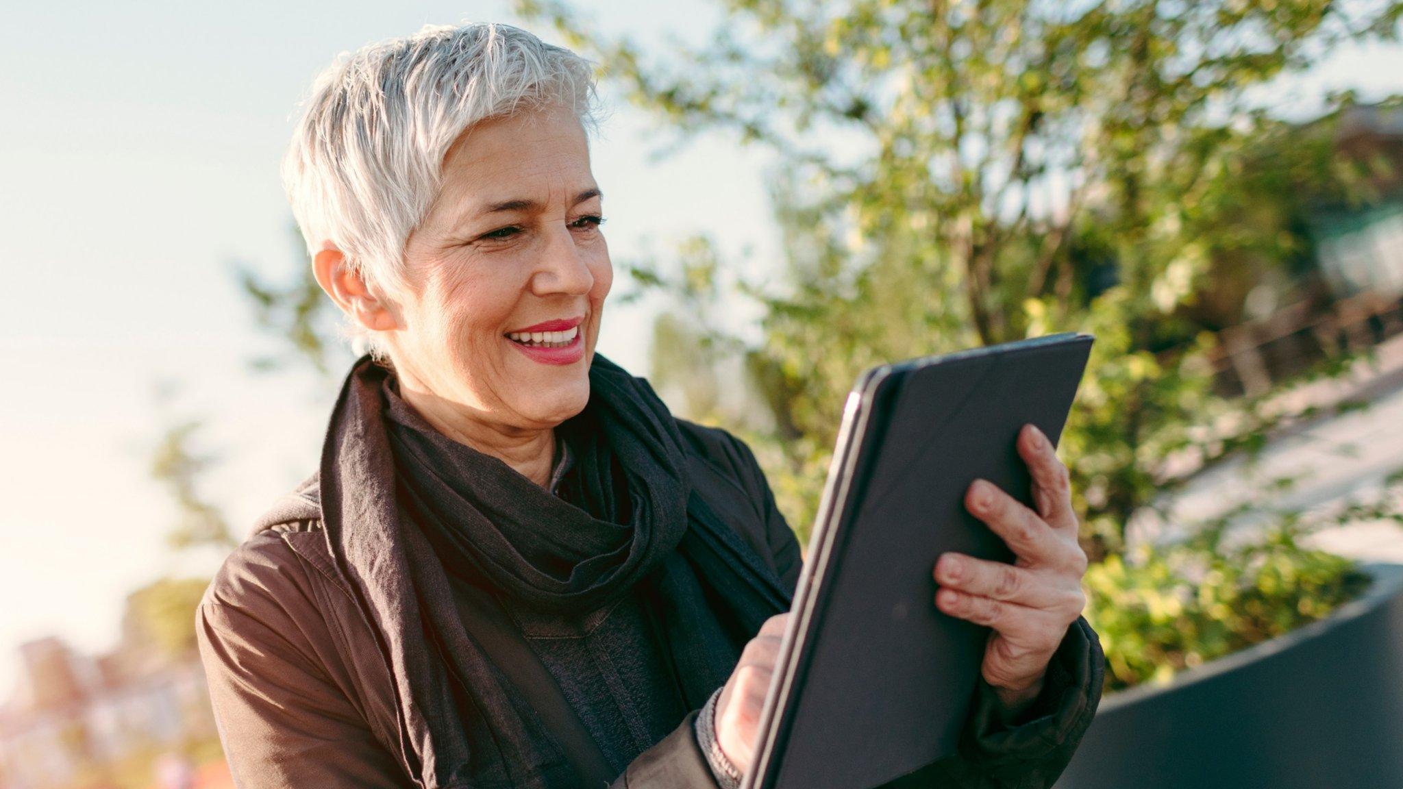 A woman using a tablet computer