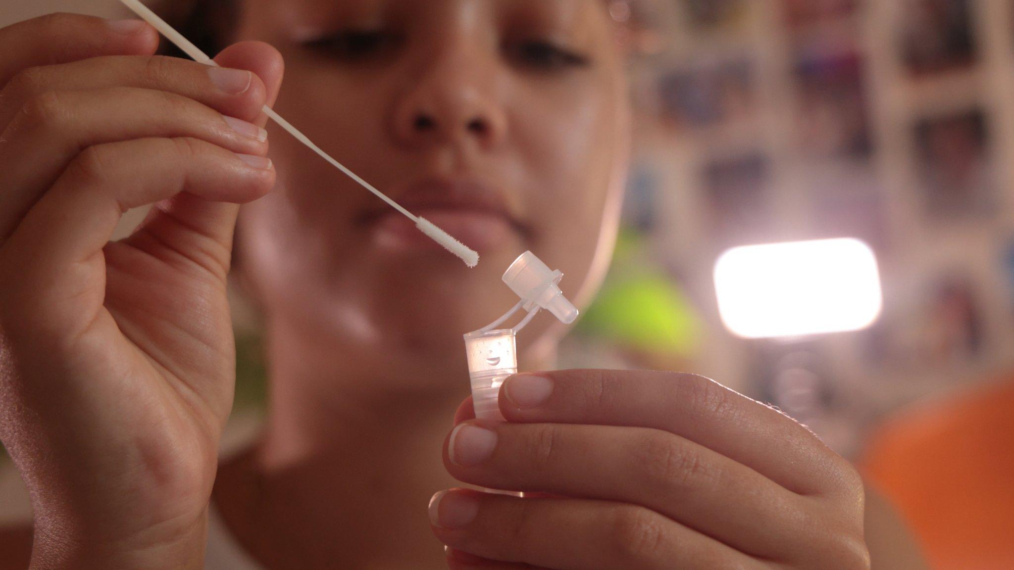 girl uses an lateral flow test